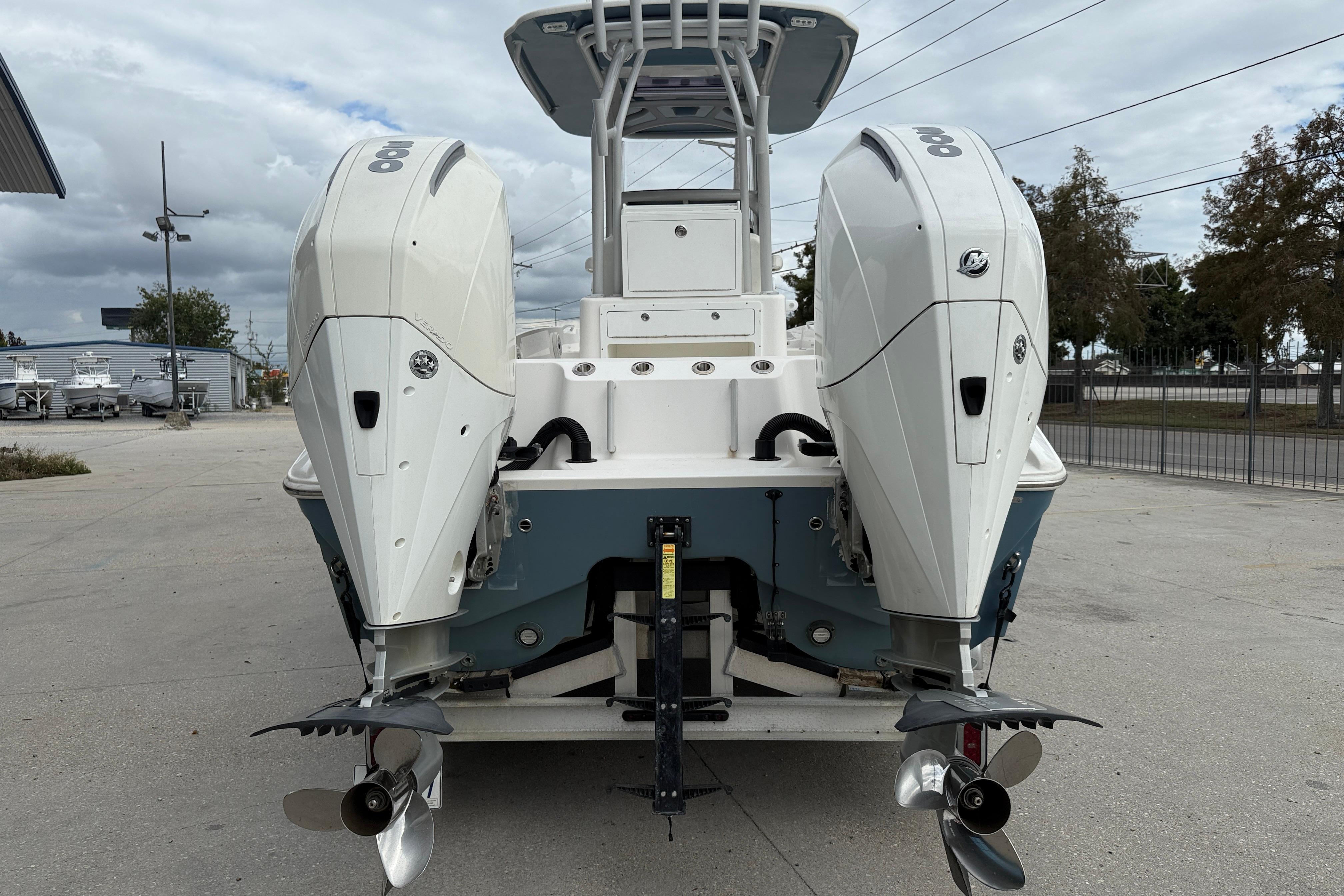 2021 Sea Cat 260 boat with dual outboard engines, parked outdoors.