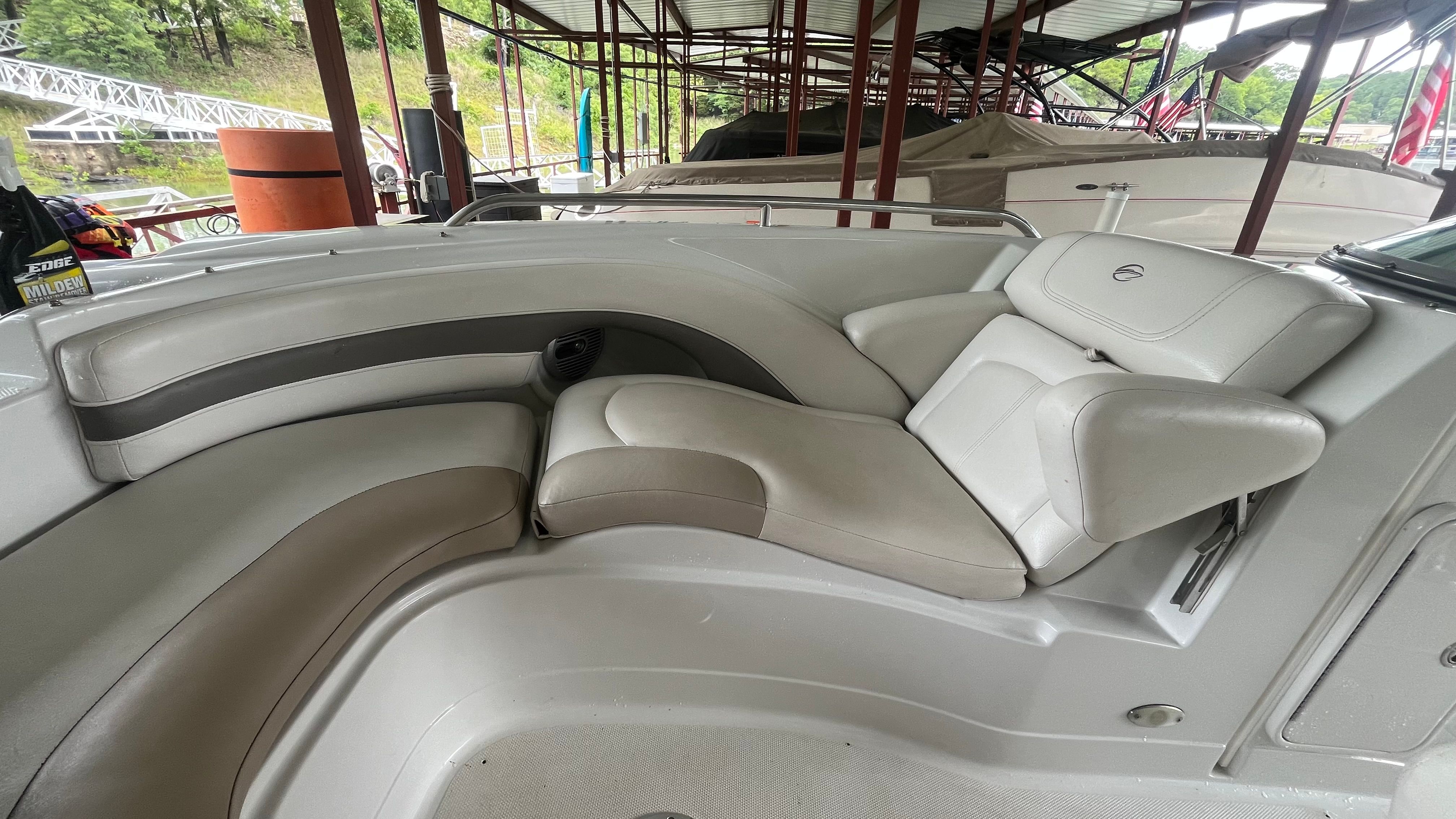 The image shows the cockpit of a 2008 Crownline 252EX boat with comfortable seating.