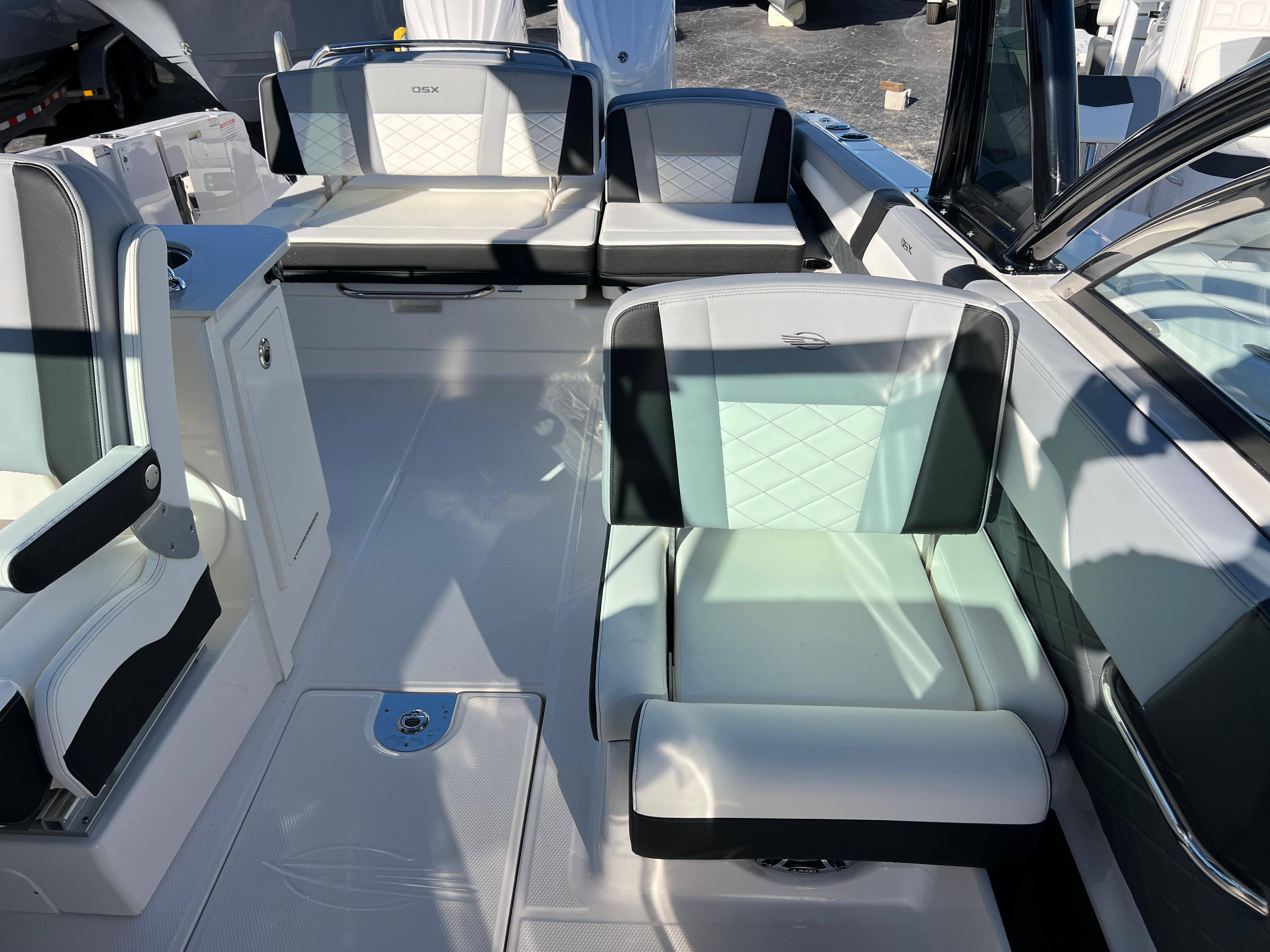 2025 Chaparral 310 OSX boat interior with modern seating and sleek design.