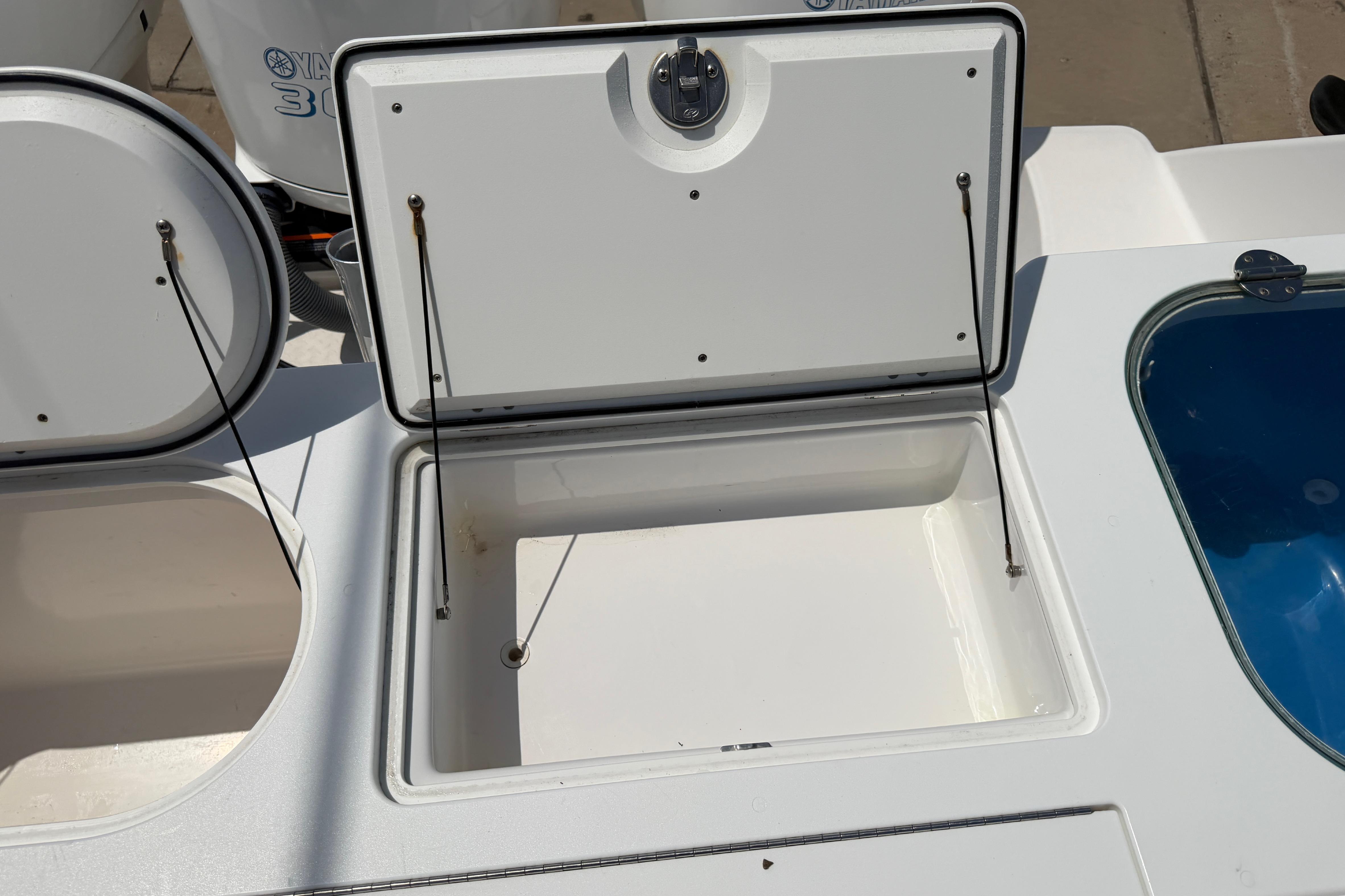 Open storage compartment on 2018 Everglades 355 Center Console boat.