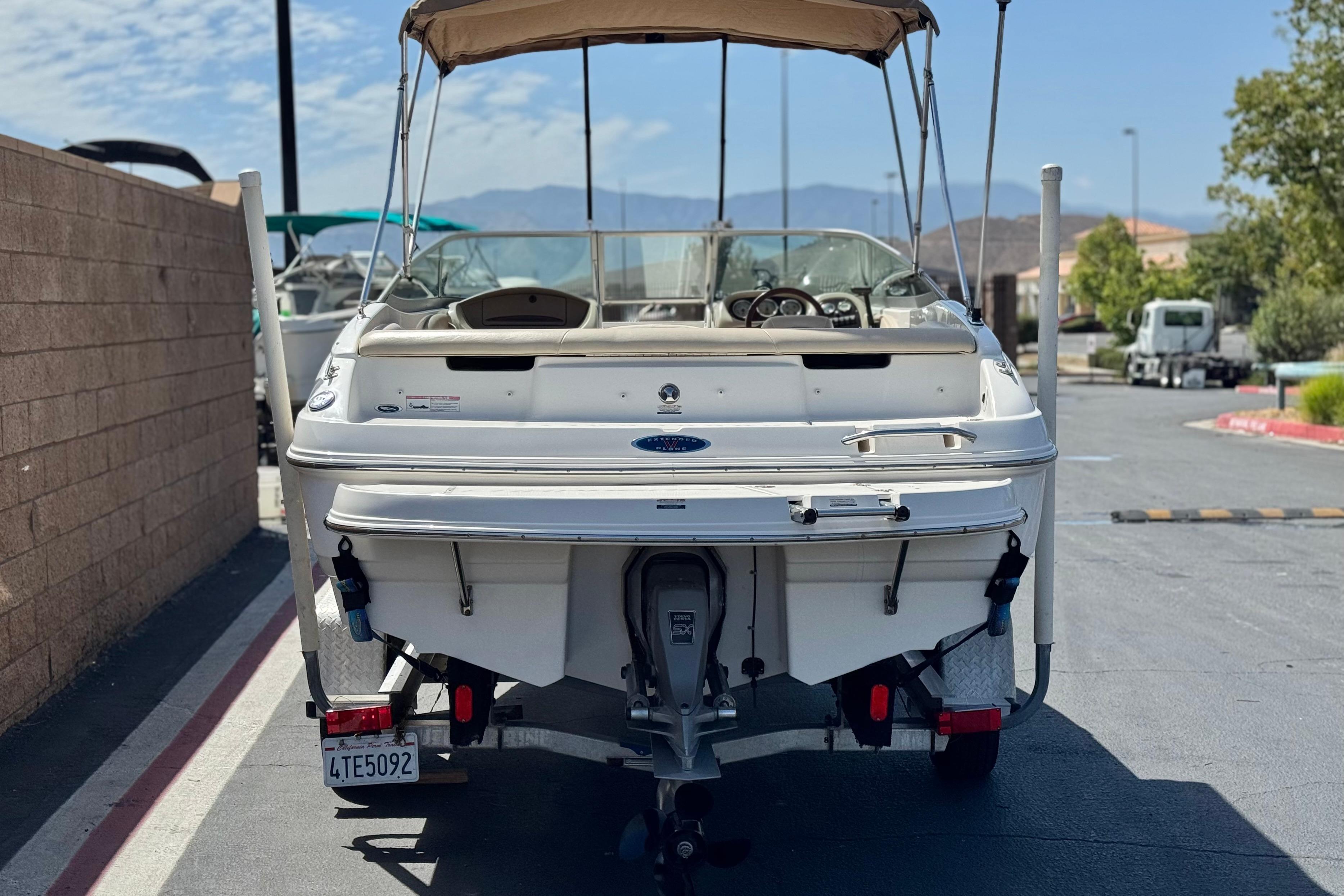 2006 Chaparral 190 SSi boat, rear view, parked on a sunny day.