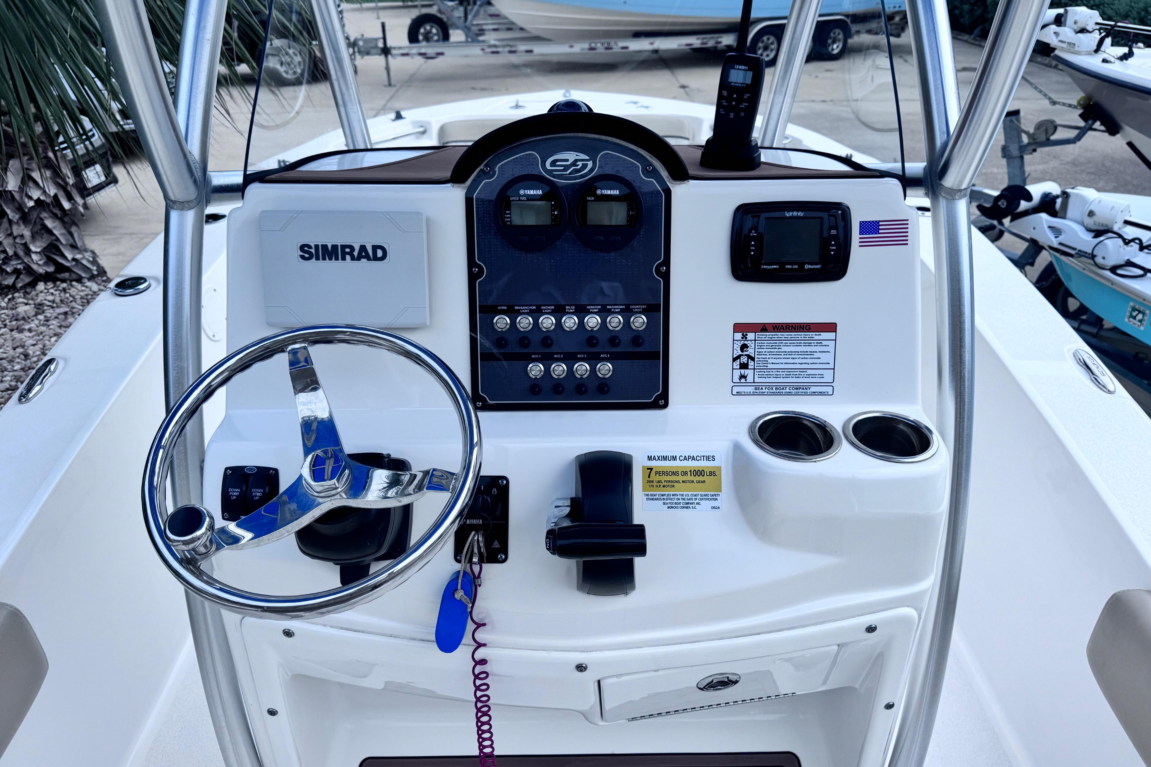 2018 Sea Fox 206 Commander boat console with steering wheel and navigation controls.