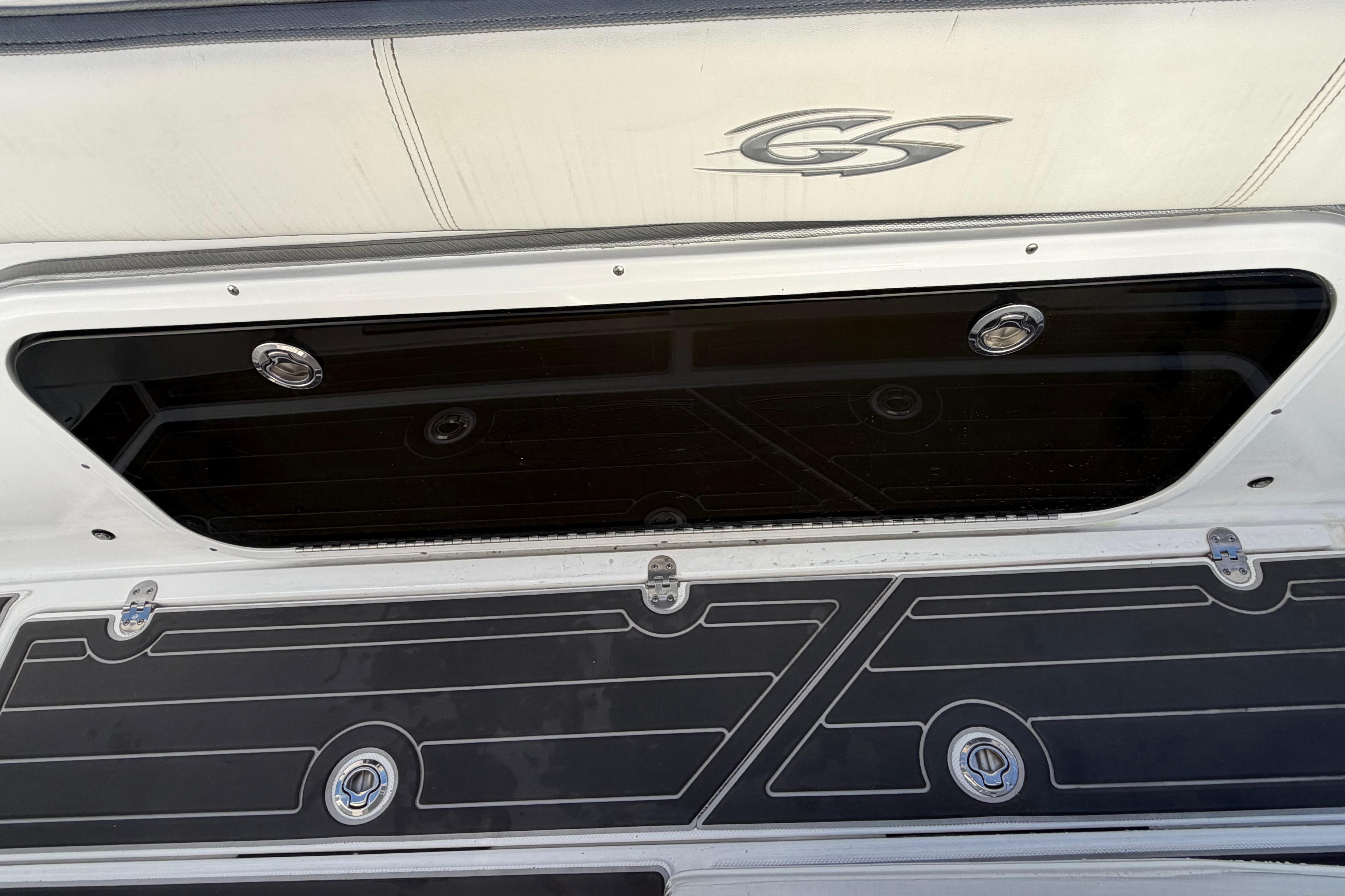 2022 Glasstream 328 Pro-XS boat deck with storage compartment and logo.