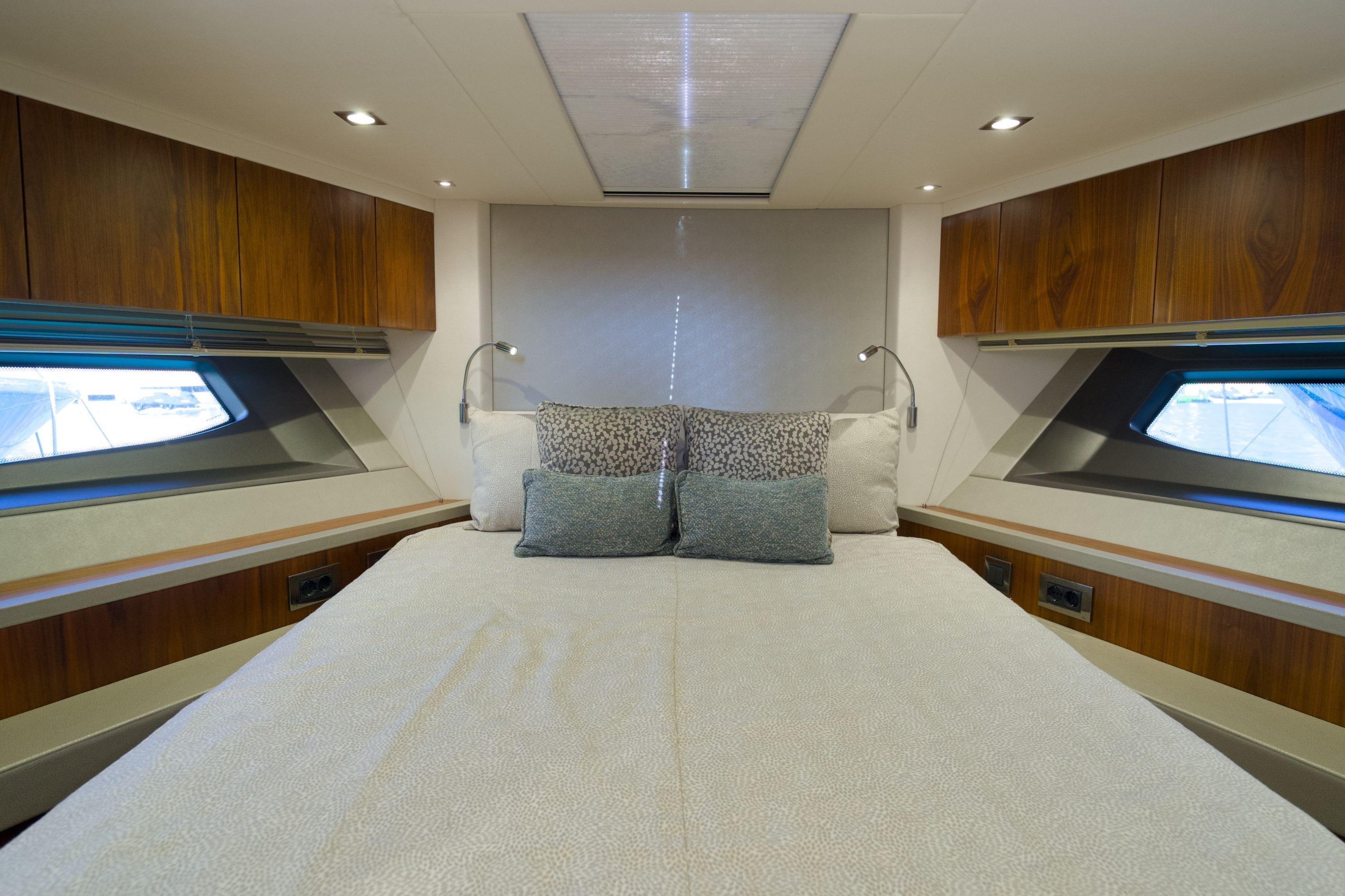Luxurious bedroom interior of 2019 Sunseeker Manhattan 52 yacht with modern design.