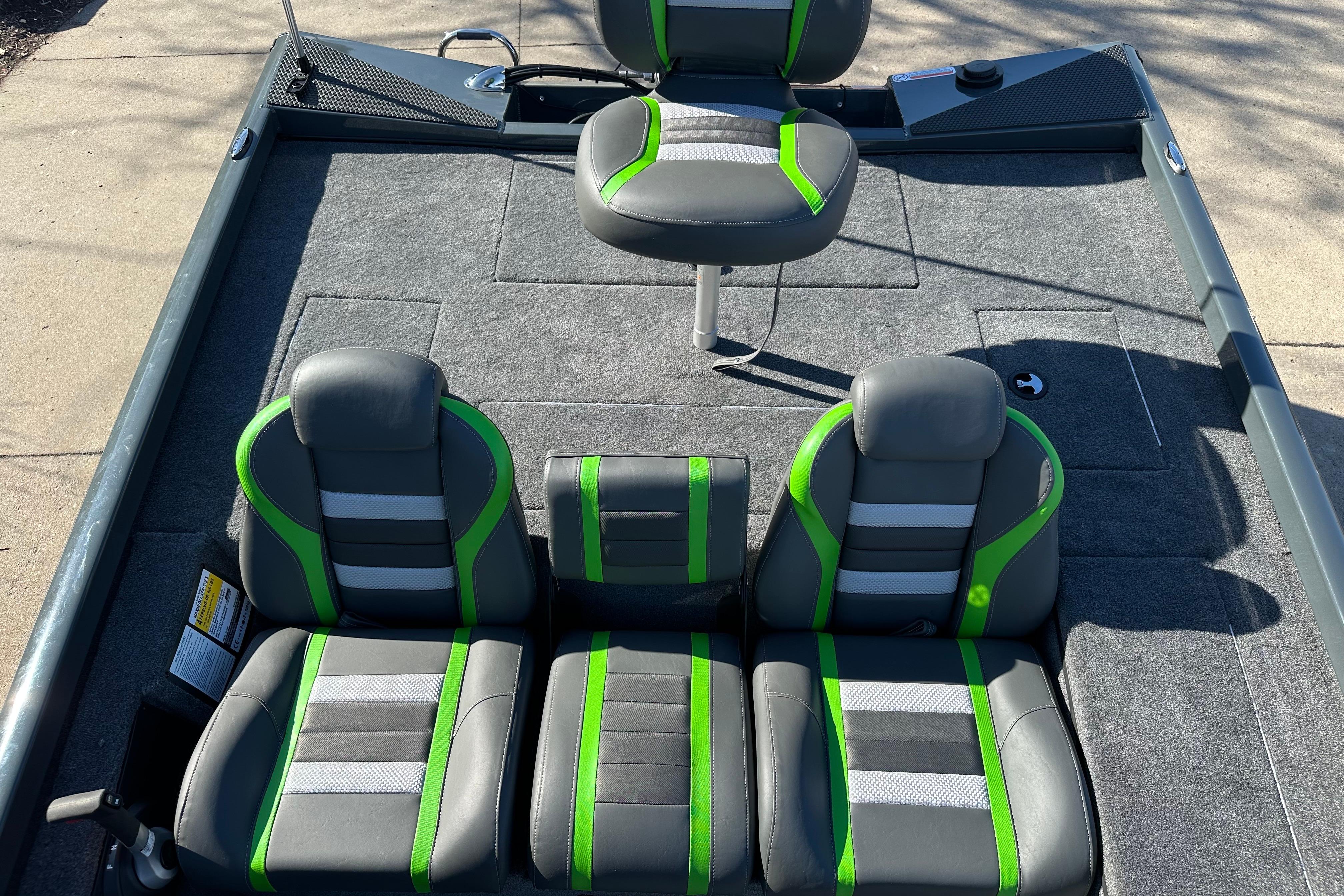 2026 Ranger RT178C boat interior with gray and green seats, carpeted flooring.