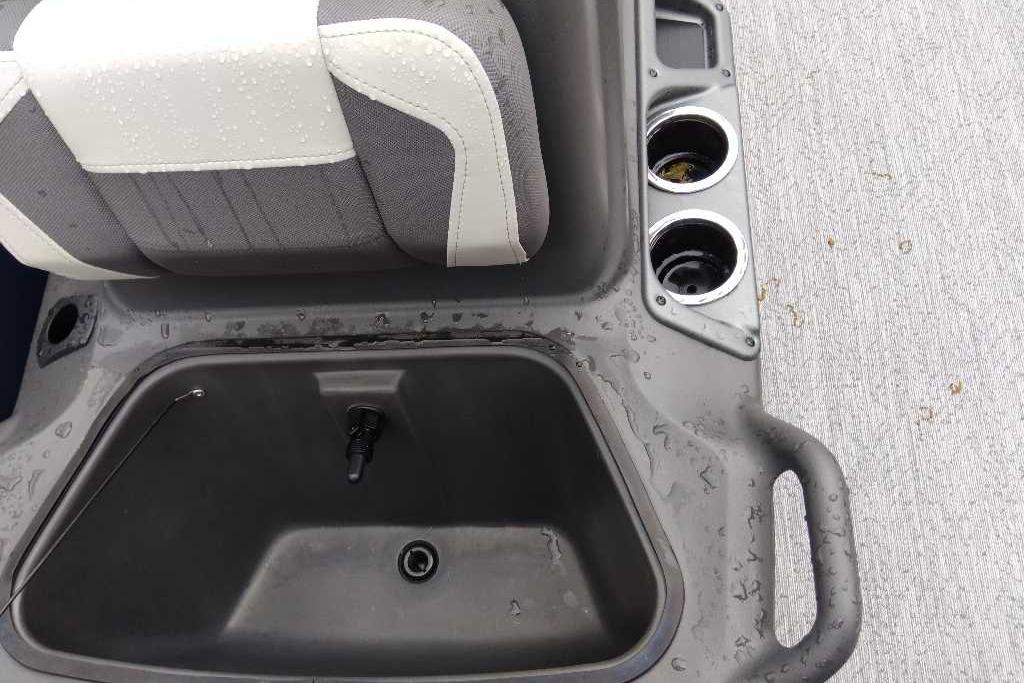 2026 Sun Tracker Bass Buggy 16 XL Select interior with seat, cup holders, and storage compartment.