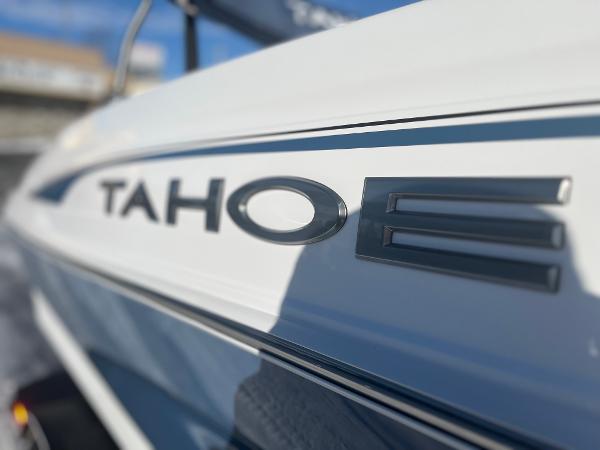 2024 Tahoe 210 Si boat close-up, showcasing sleek design and branding.