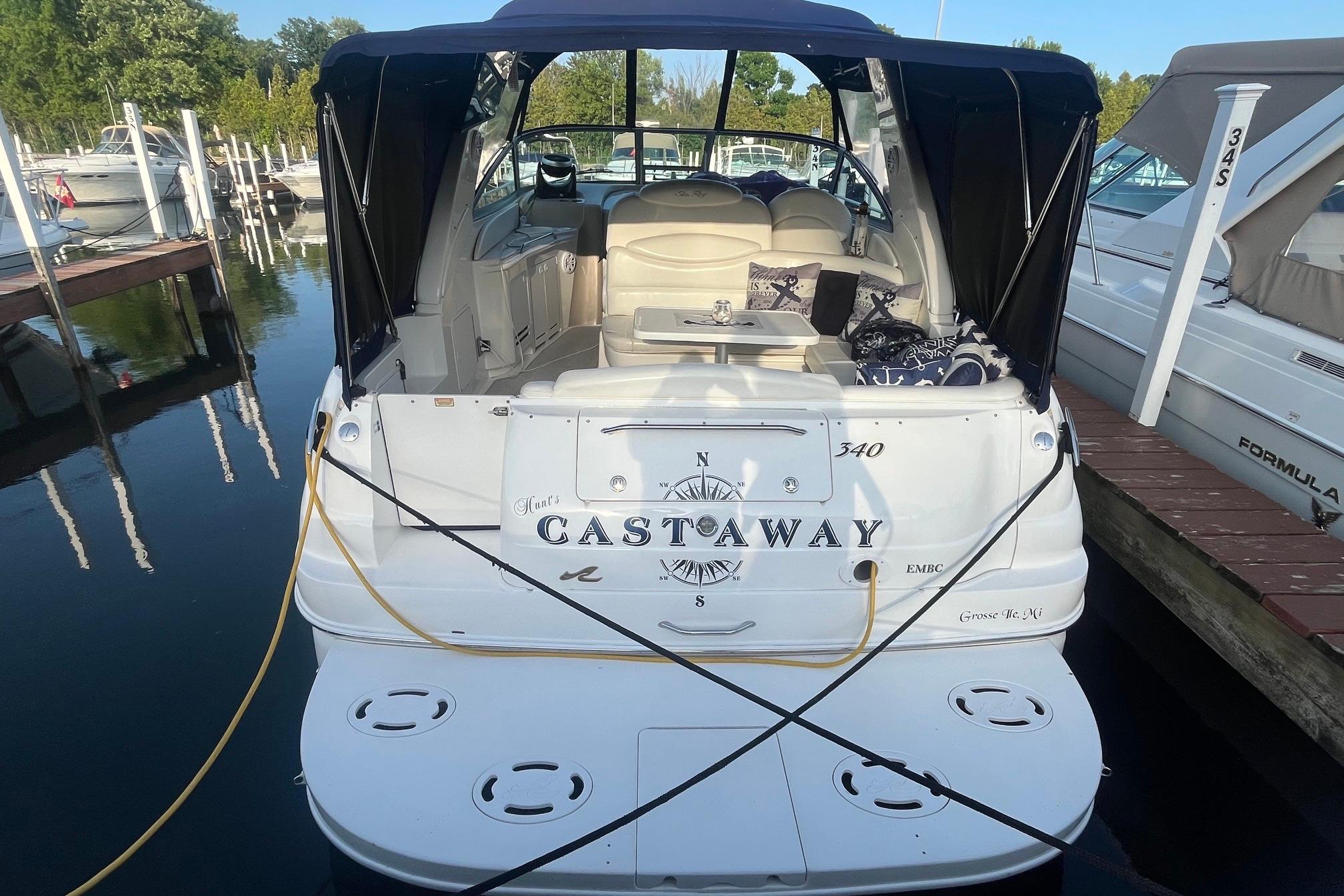 2001 Sea Ray 340 Sundancer docked, featuring "Castaway" name on the stern.