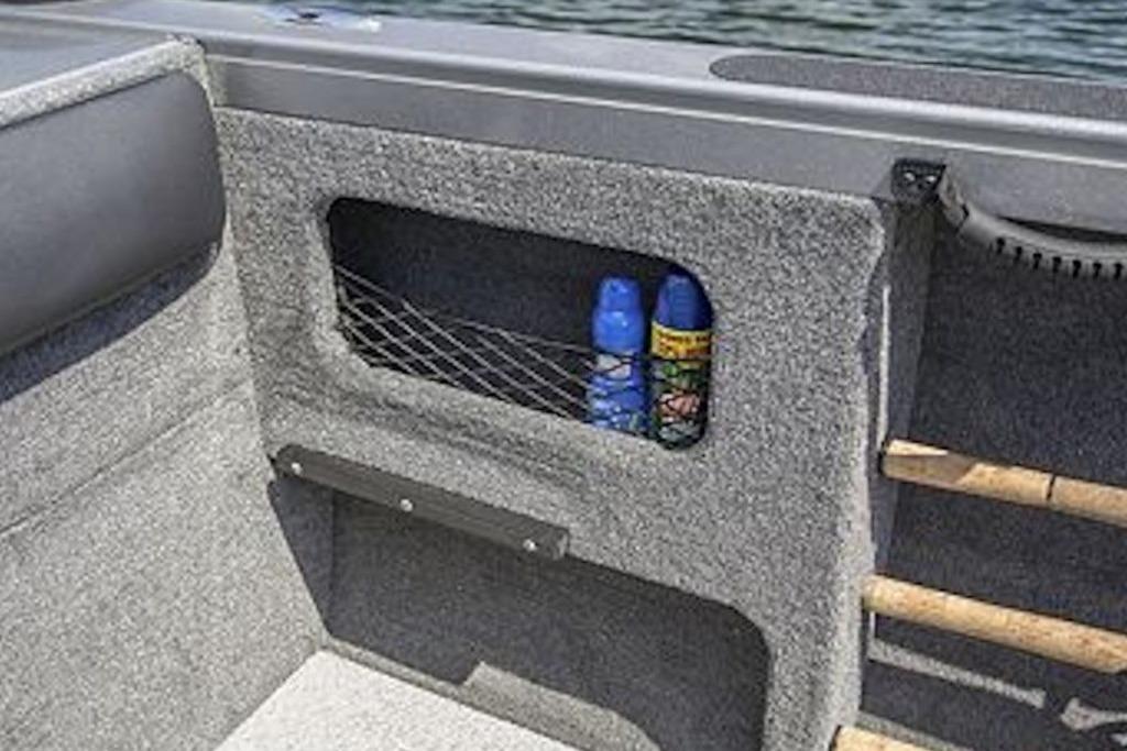 Interior storage compartment of 2026 Crestliner 2050 Authority boat with netted pocket.