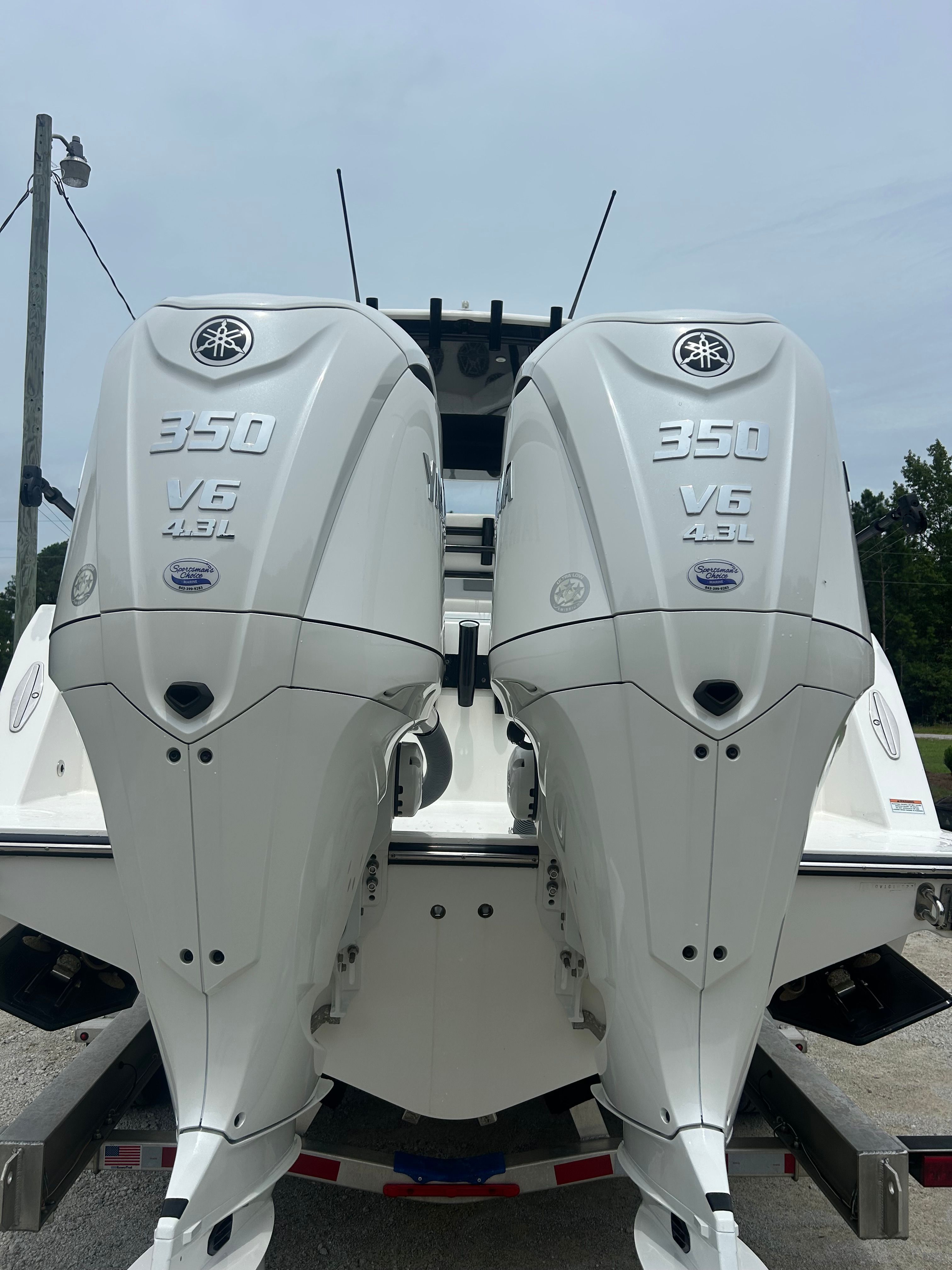 Two powerful outboard engines on a Contender 30 ST boat, ready for high-speed adventures.