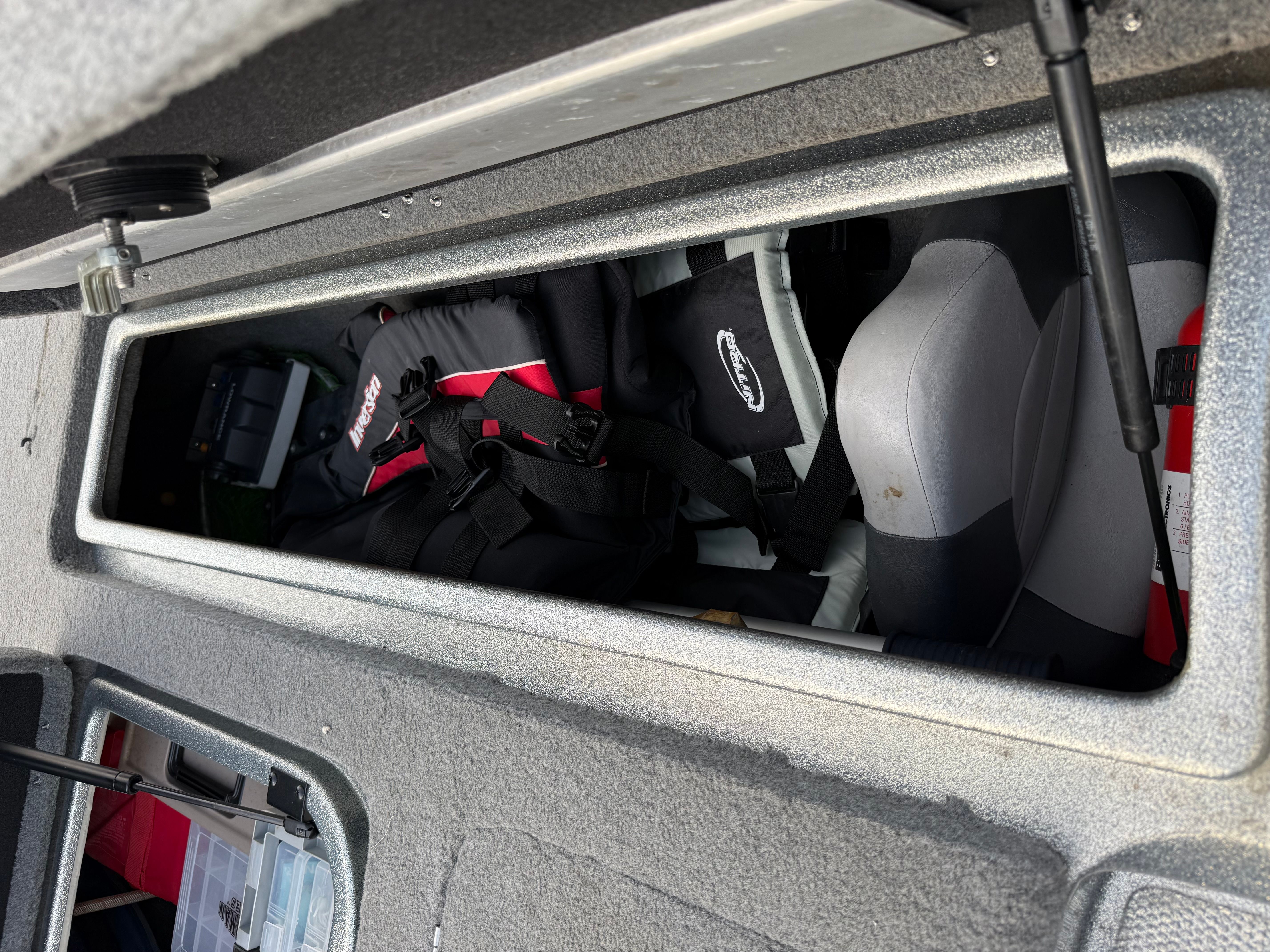 Storage compartment in 2004 Nitro NX 898 DC boat with gear.