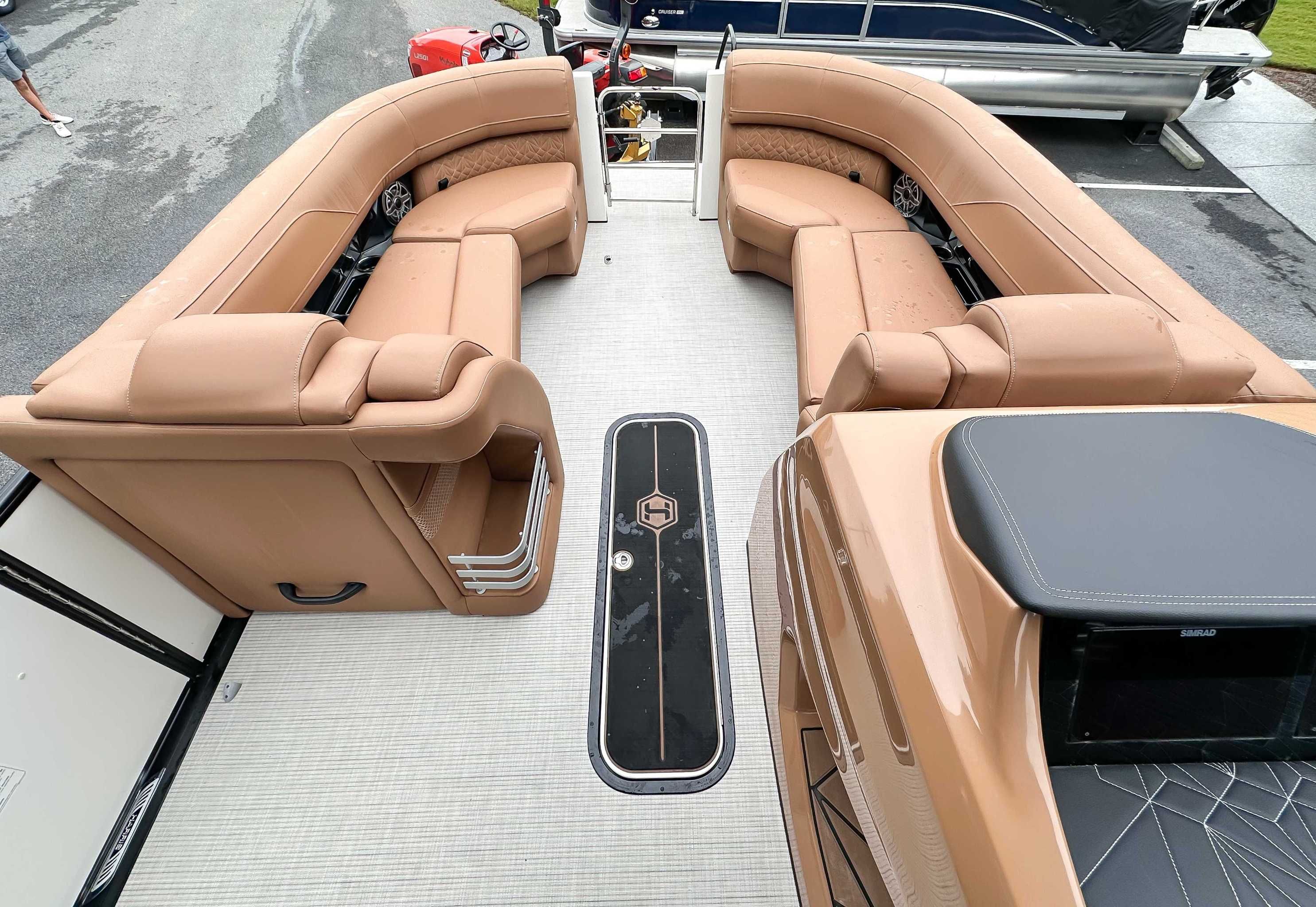 Interior of 2025 Harris Grand Mariner 230 SLDH with luxurious leather seating.