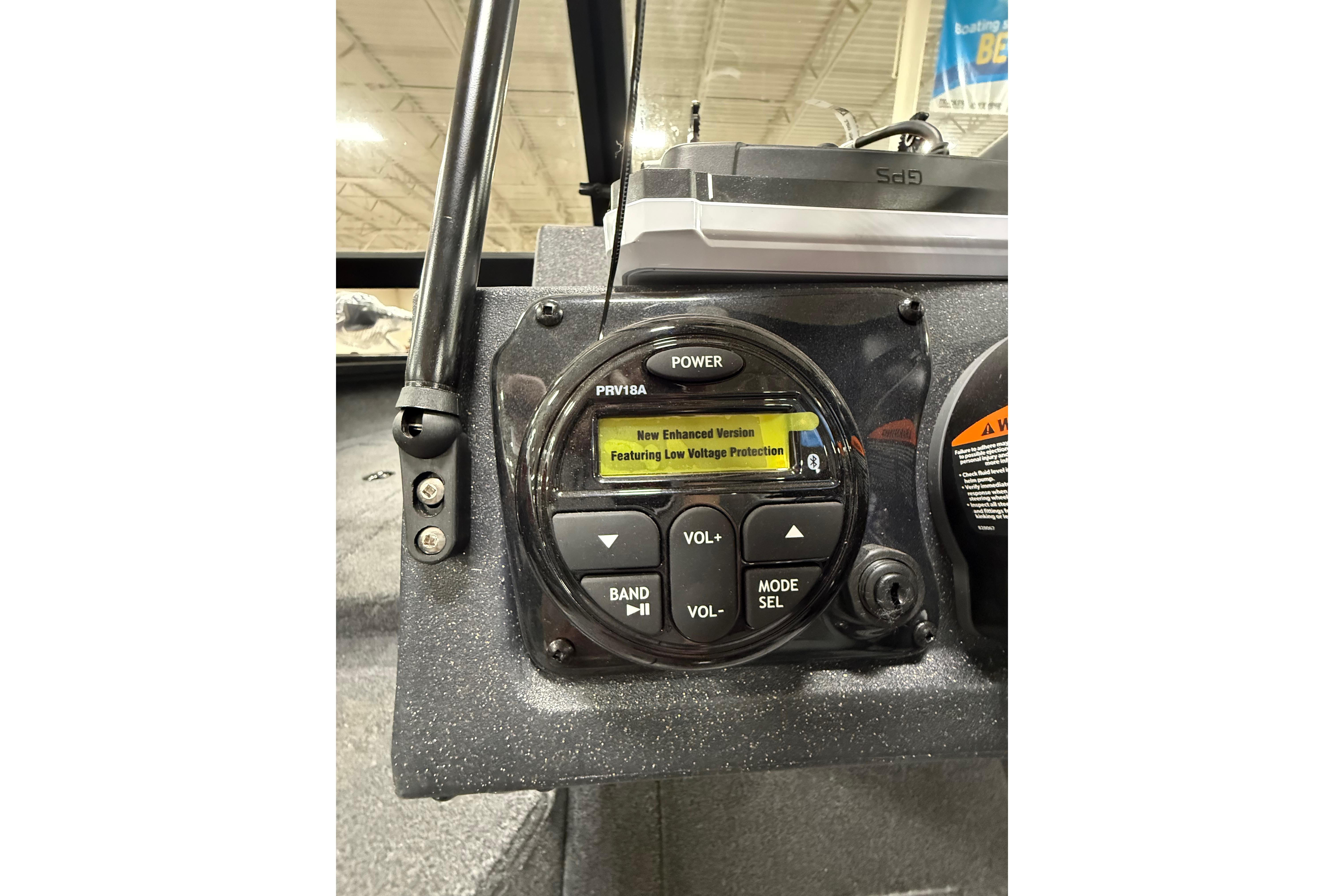 Control panel of 2026 Tracker Targa V-19 WT boat featuring audio system and low voltage protection.