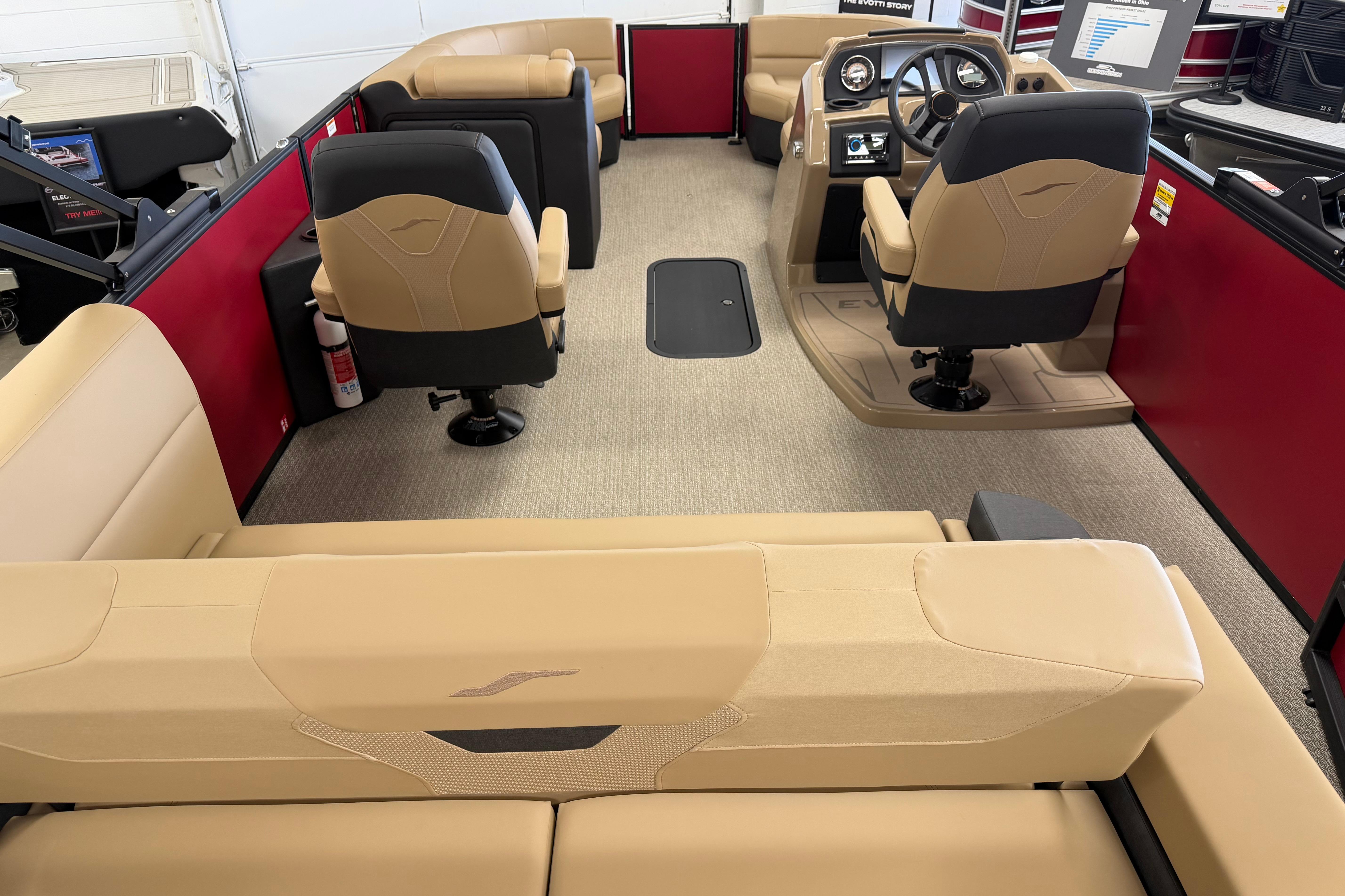Luxurious interior of 2026 Evotti 523CS boat with beige seating and modern dashboard.