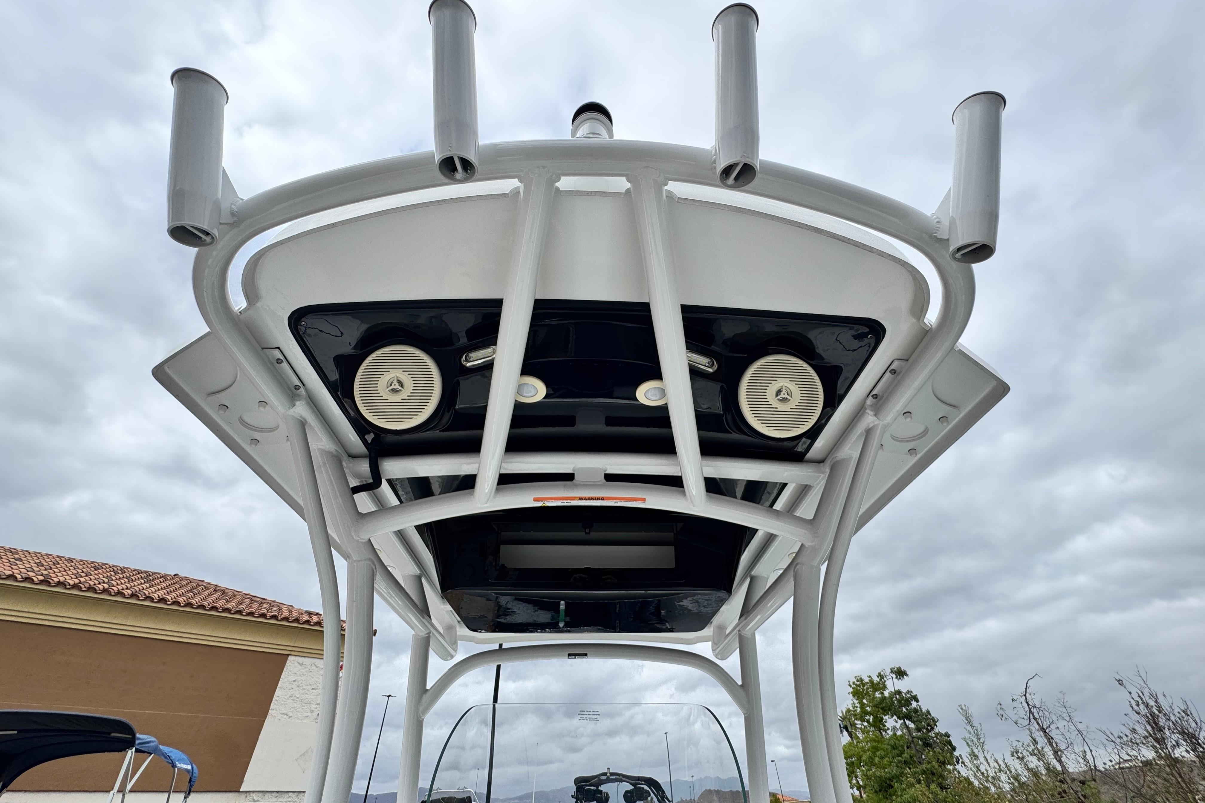 2022 Wellcraft 222 Scarab Offshore boat top view with rod holders and speakers.