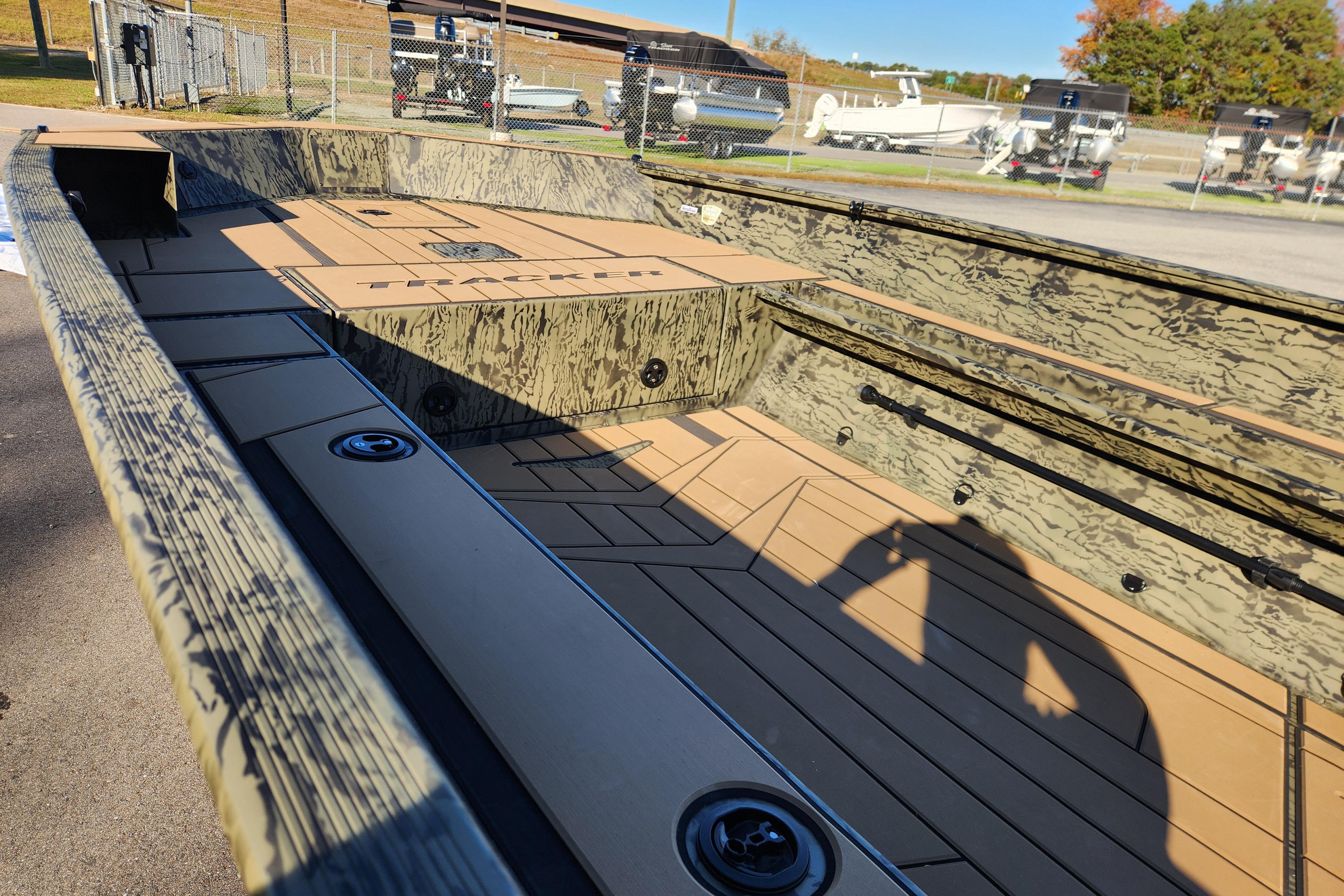 2026 Tracker Grizzly 1756 T Marsh boat interior with camouflage design and spacious deck.