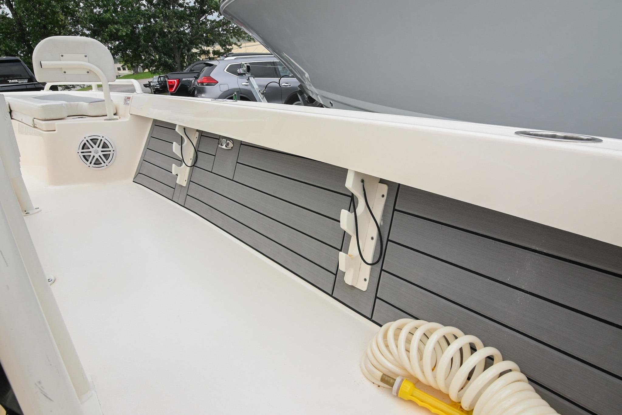 Interior view of a 2021 Pathfinder 2200 TRS boat, featuring seating and storage compartments.
