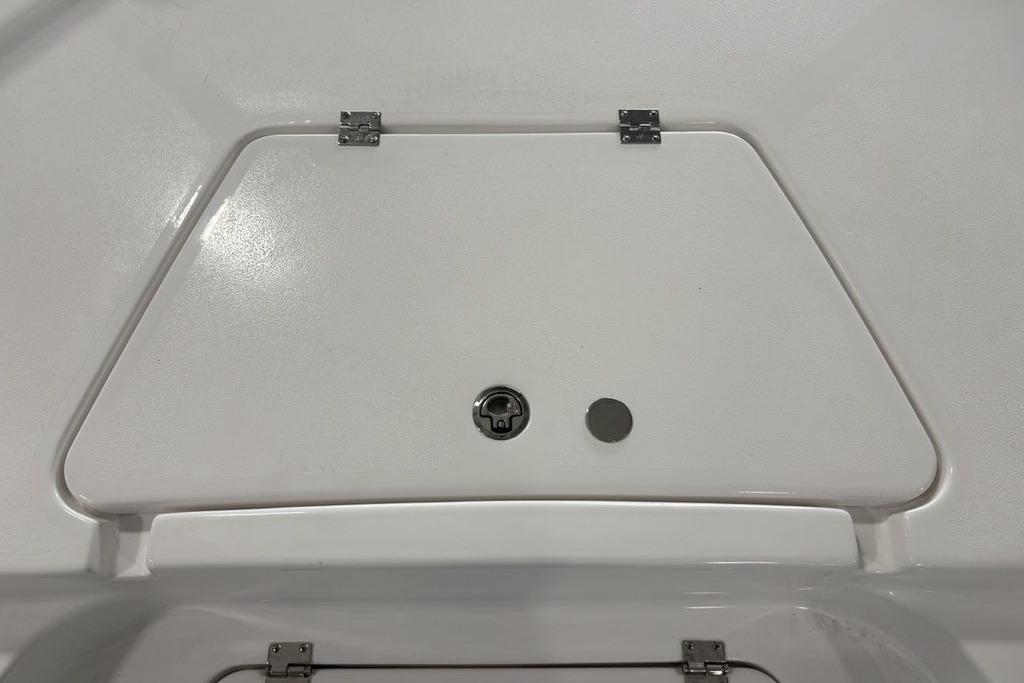 2026 Tidewater 2210 Carolina Bay boat compartment with secure latch and hinges.