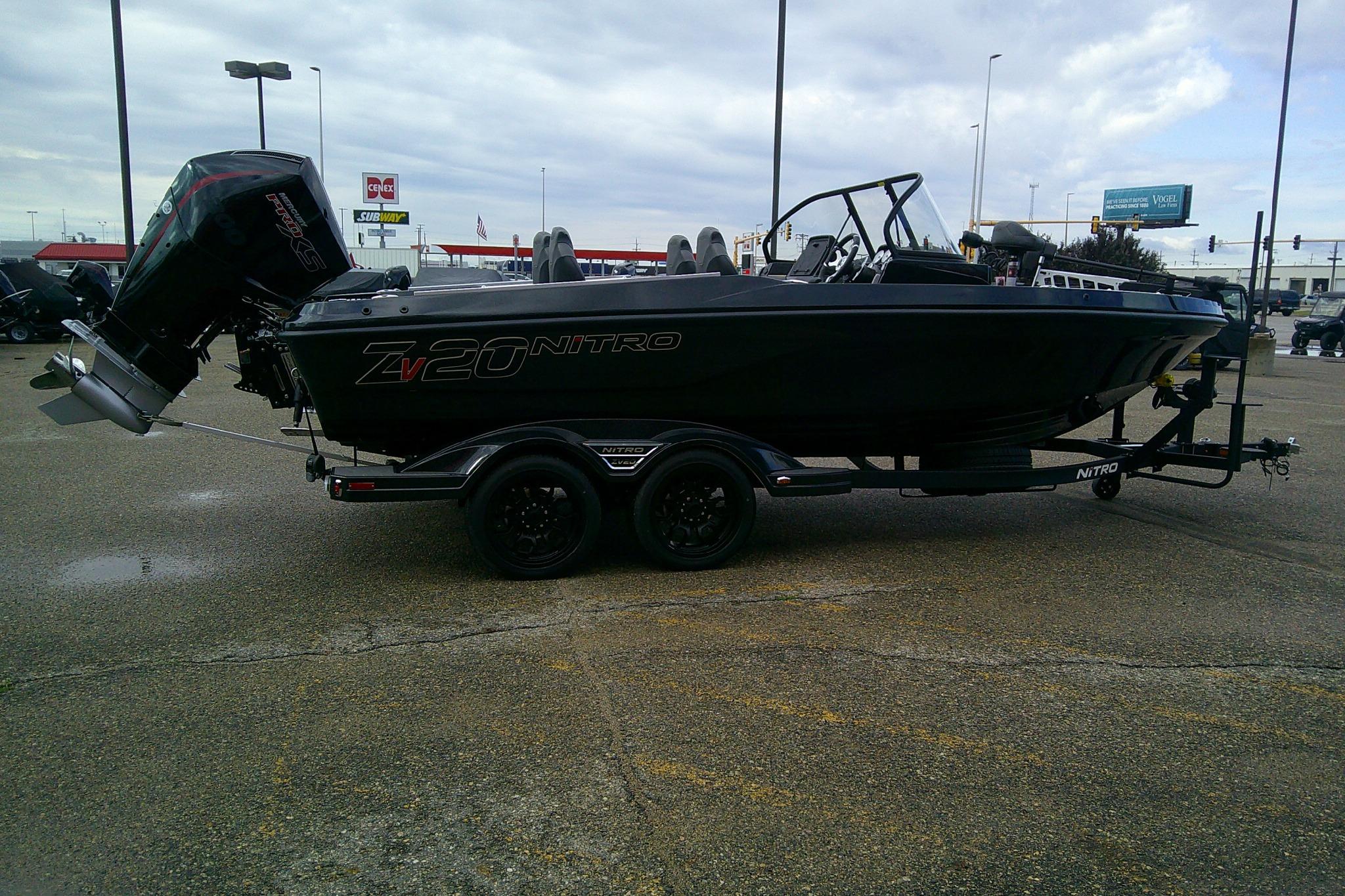 2026 Nitro ZV20 boat on trailer in parking lot, overcast sky.
