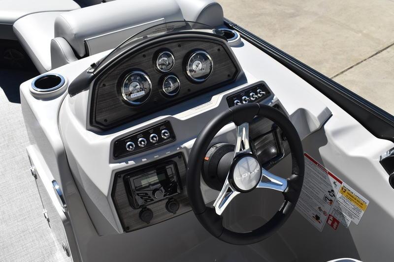 2026 Lowe SS 230 boat dashboard with steering wheel and instrument panel.