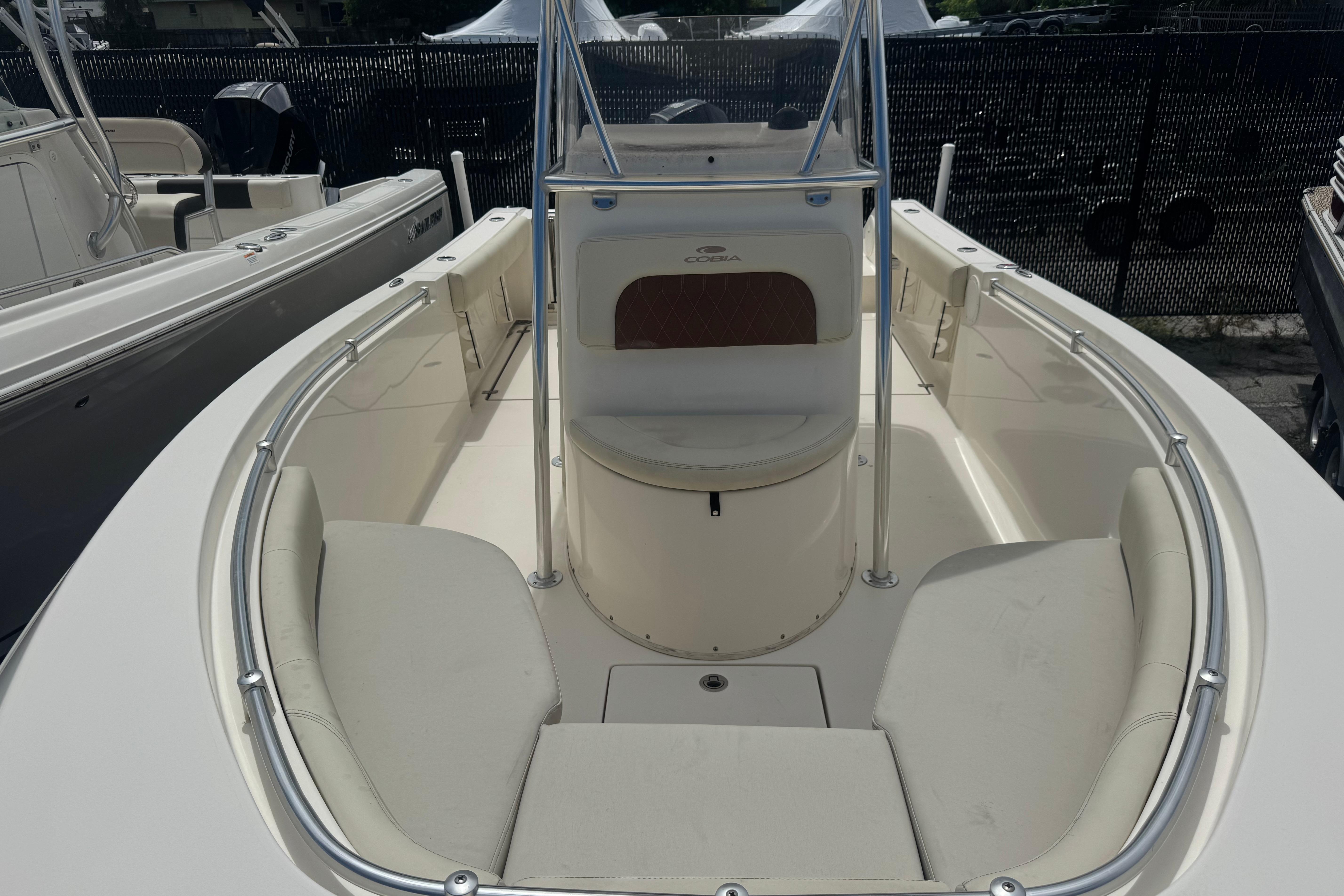 2022 Cobia 237 Center Console boat interior with cushioned seating and sleek design.