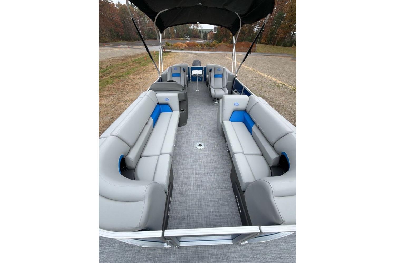 2026 Sun Tracker Party Barge 22 DLX interior with spacious seating and canopy.