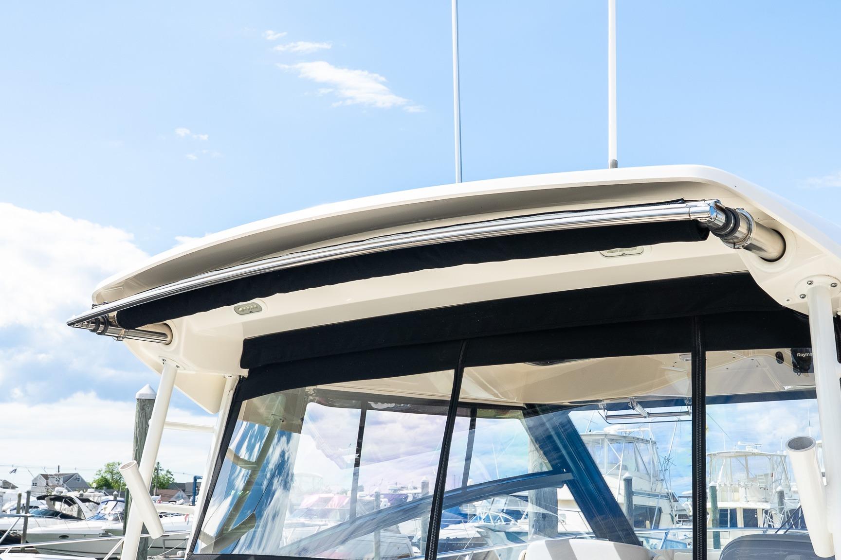 2020 Boston Whaler 325 Conquest boat with sleek hardtop and clear windows.