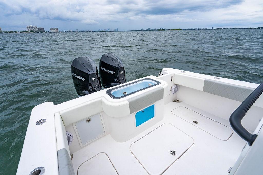 Reef Runner 280 boat, 2027 model, with dual Mercury engines on open water.
