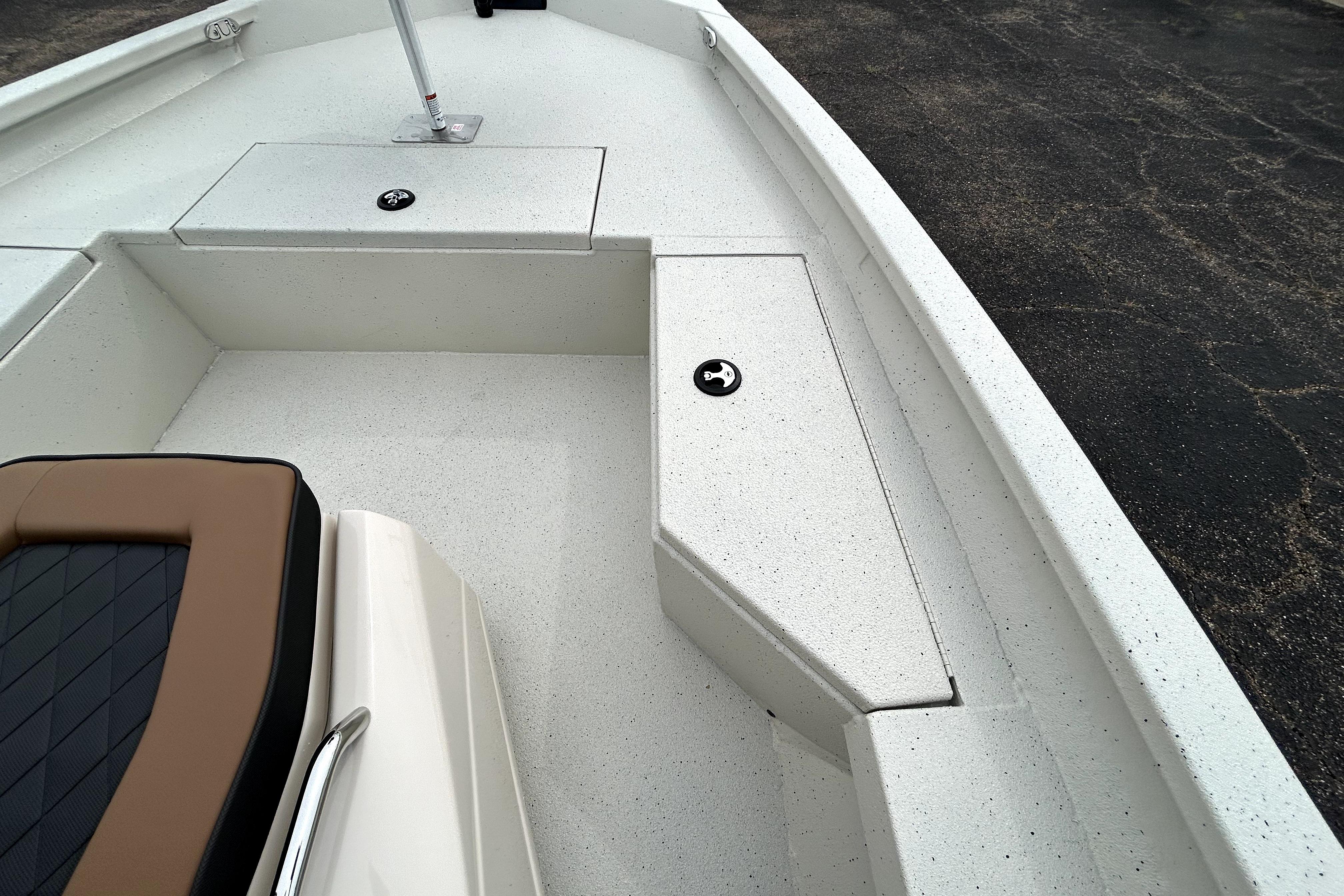 2026 Xpress H20B Bay boat interior with seating and storage compartments.