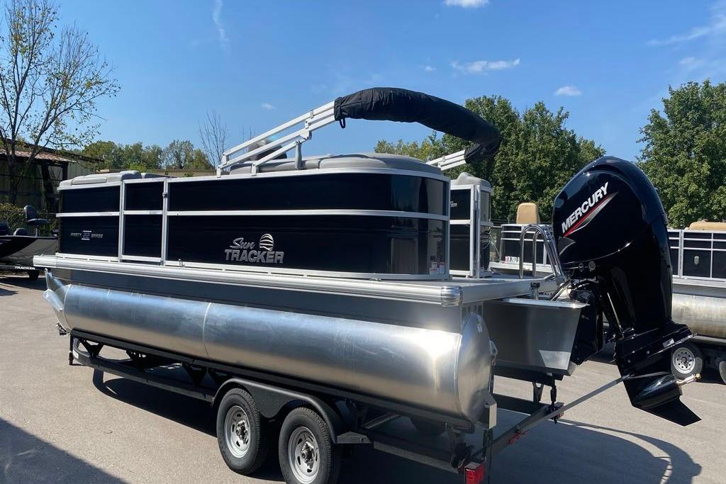 2026 Sun Tracker Party Barge 22 DLX pontoon boat with Mercury outboard motor.