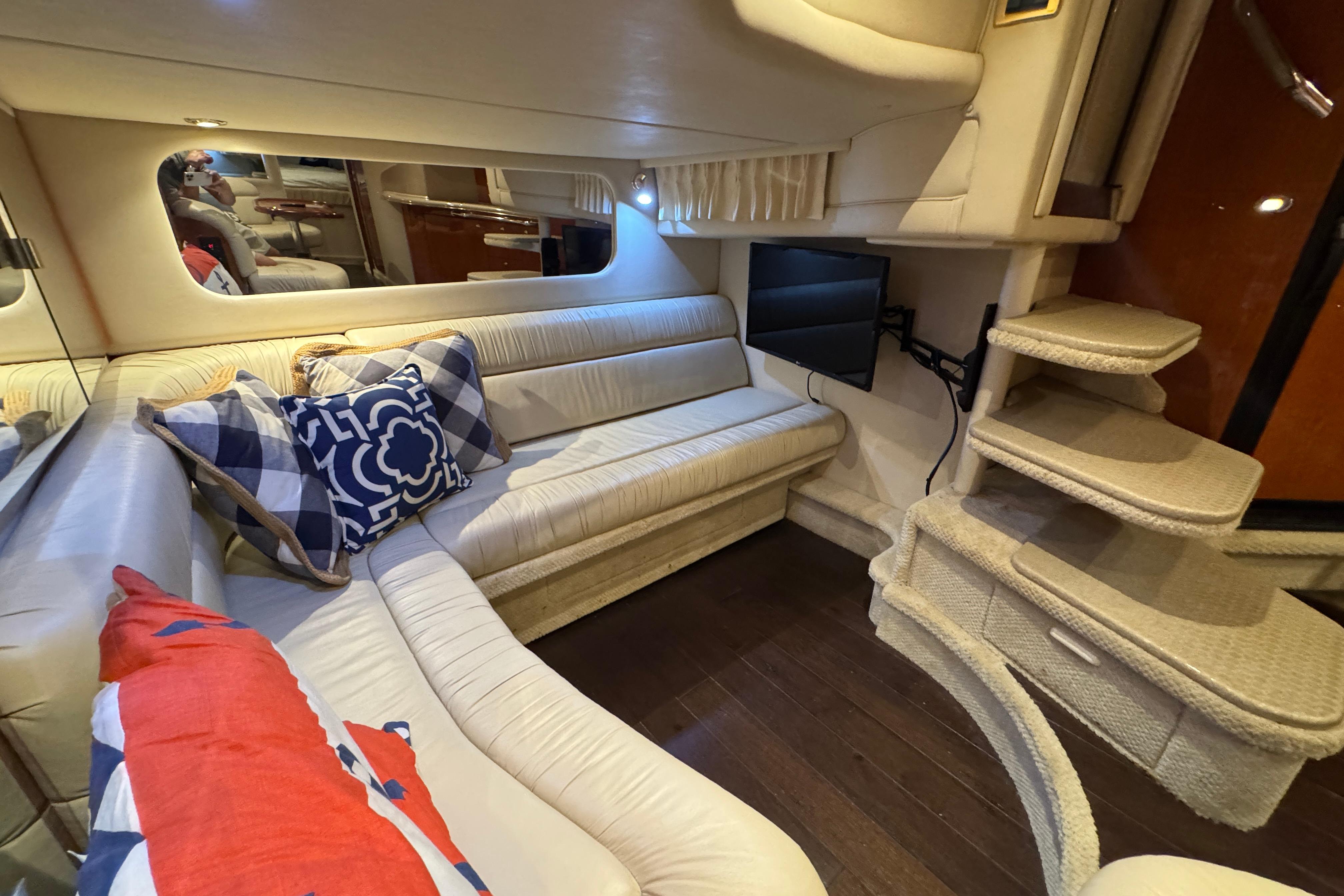 Luxurious interior of 2001 Sea Ray 380 Sundancer yacht with plush seating and stylish decor.