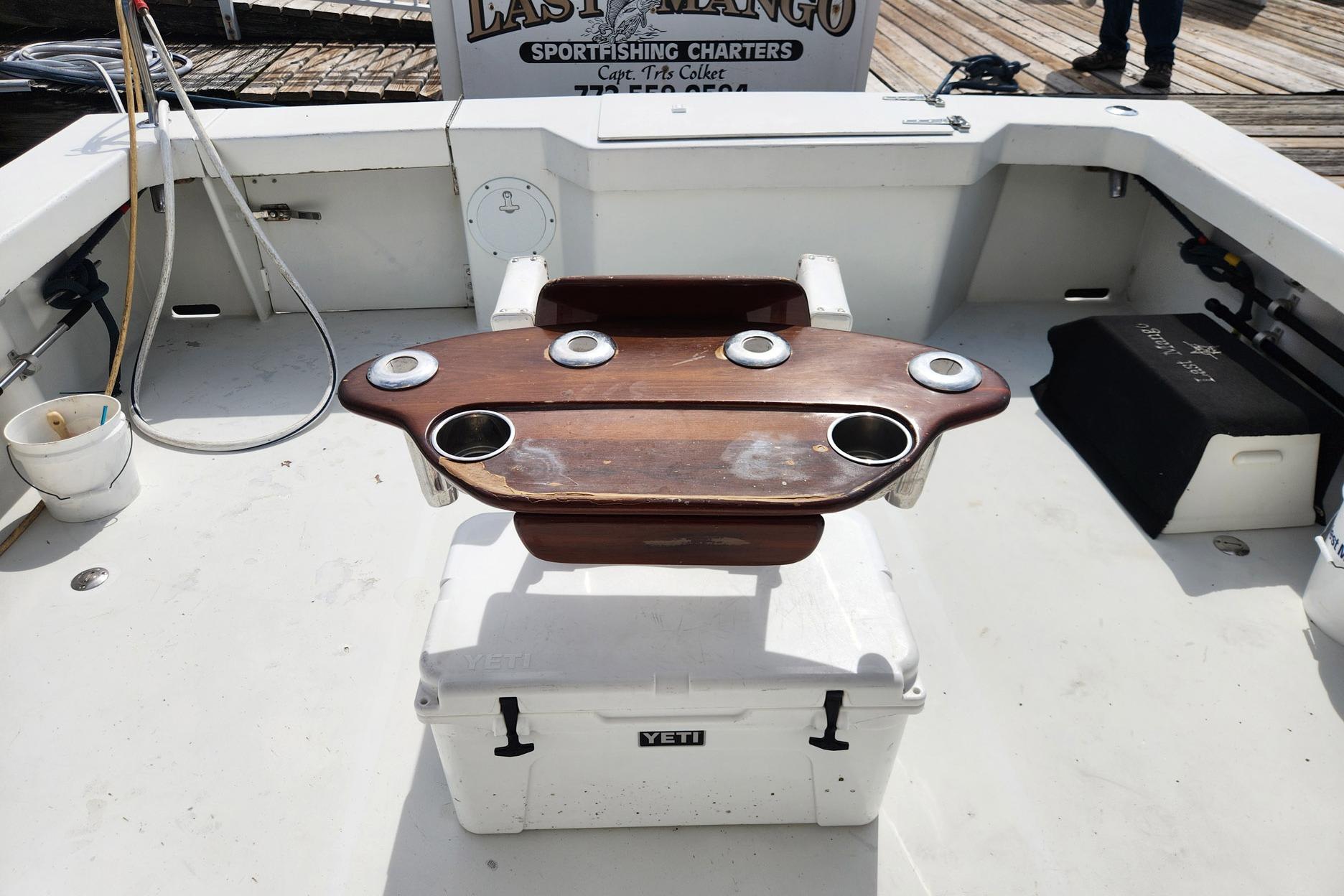 1987 Young Brothers Custom Sport Fish boat deck with fishing chair and YETI cooler.