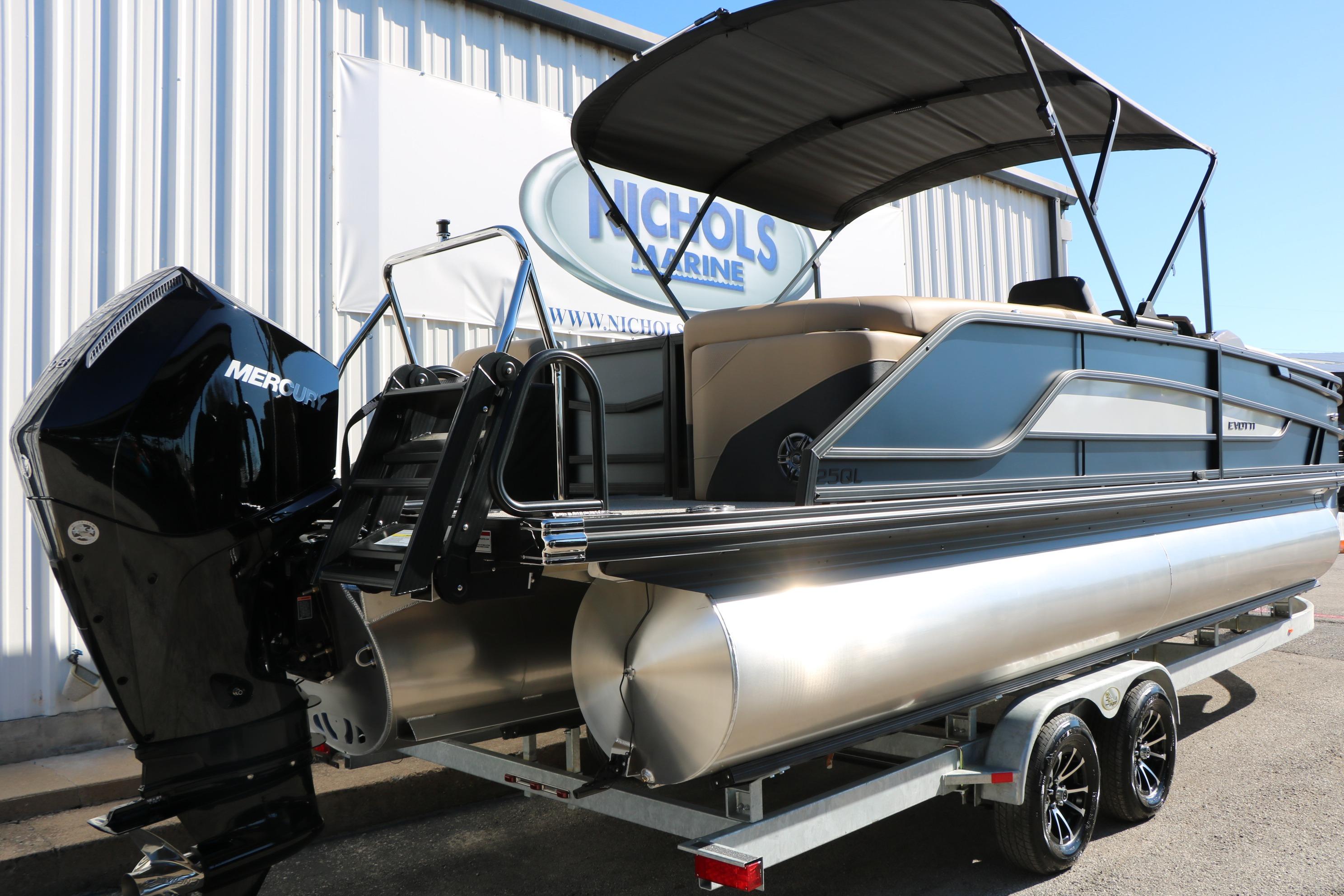 2026 Evotti 525 QL Tri-Toon boat with Mercury engine on trailer at Nichols Marine.