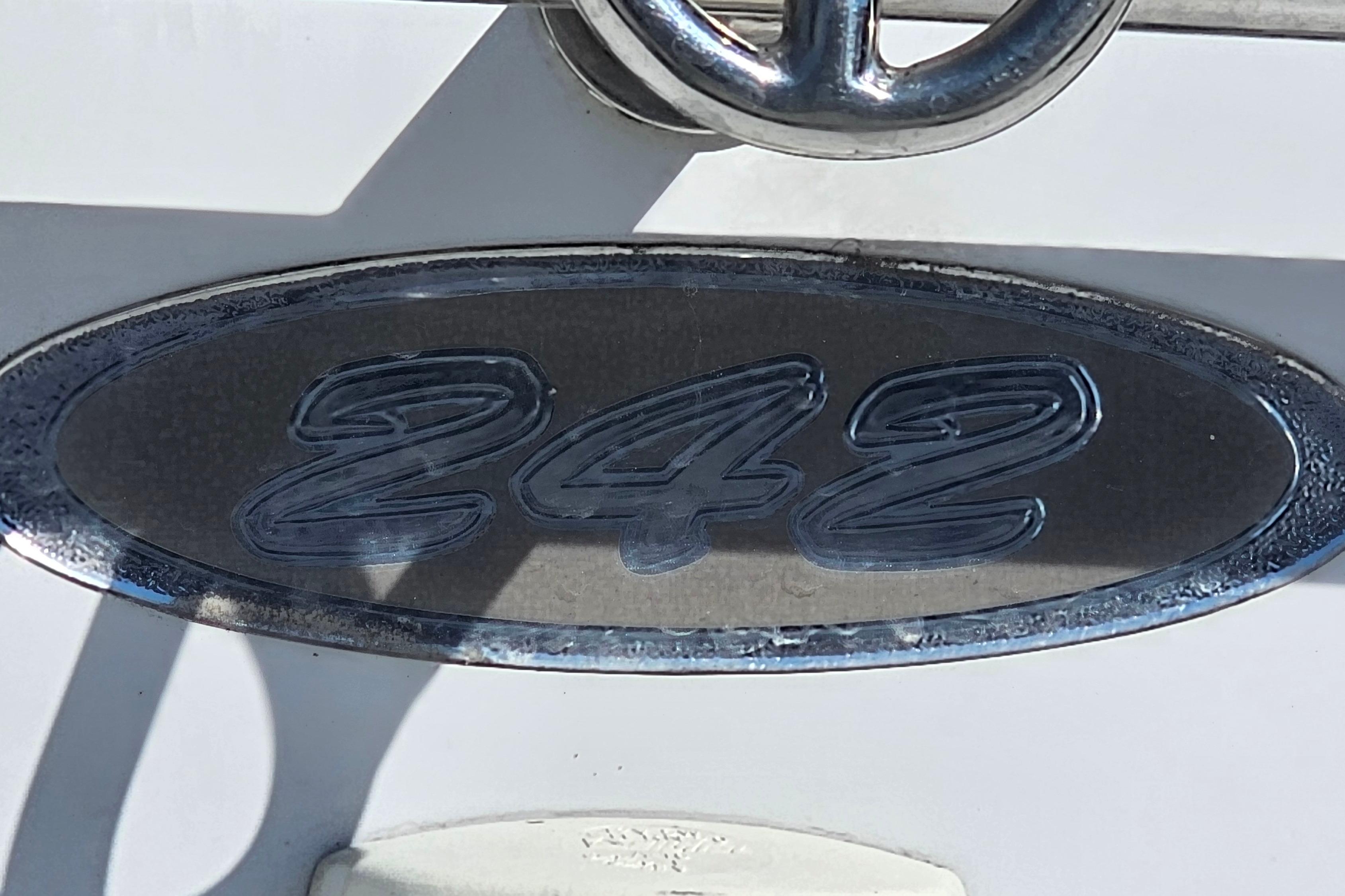 Crownline 242 CR boat emblem, 2000 model, metallic finish.