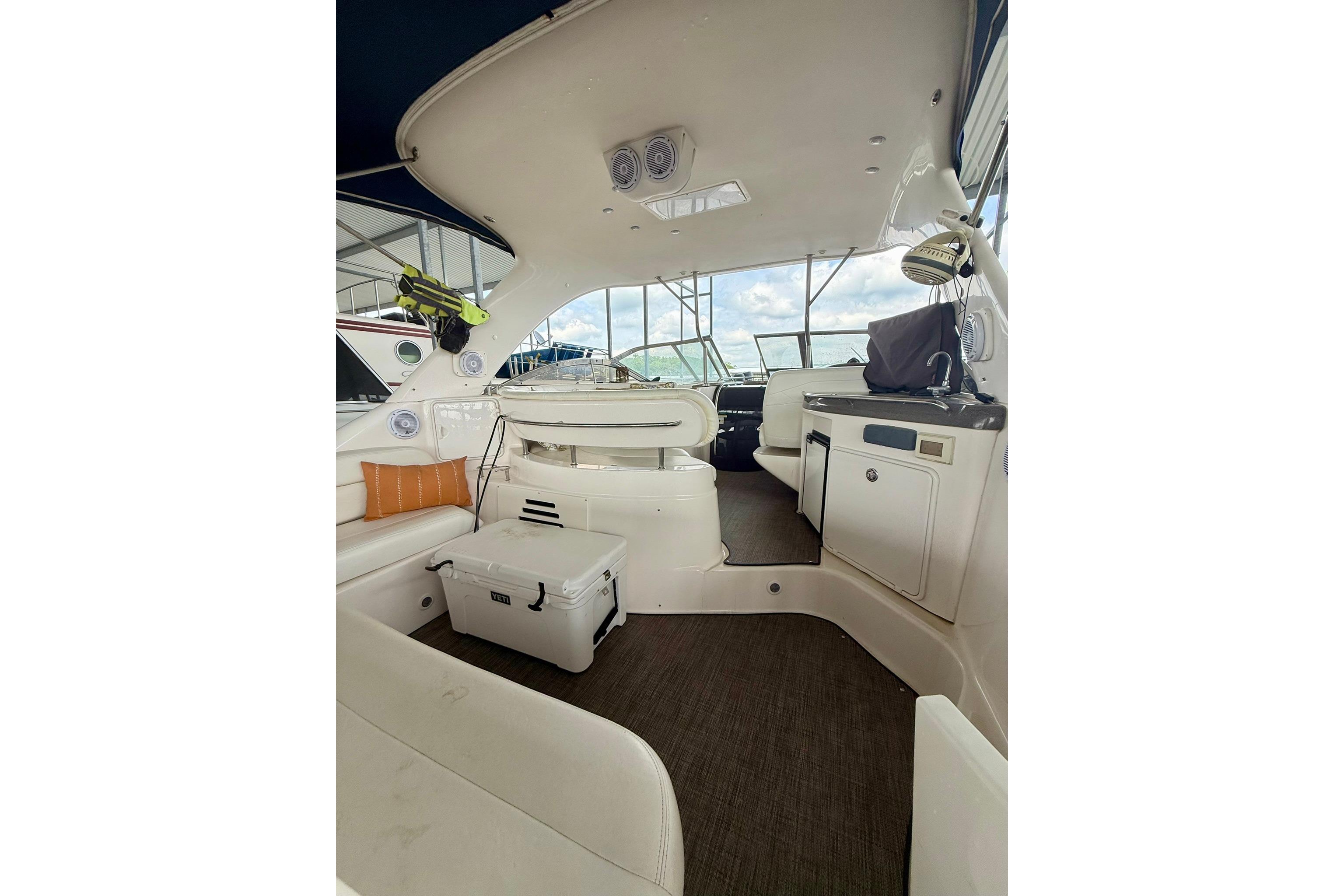 Interior of 2006 Regal Commodore 4060 yacht with seating and kitchenette.
