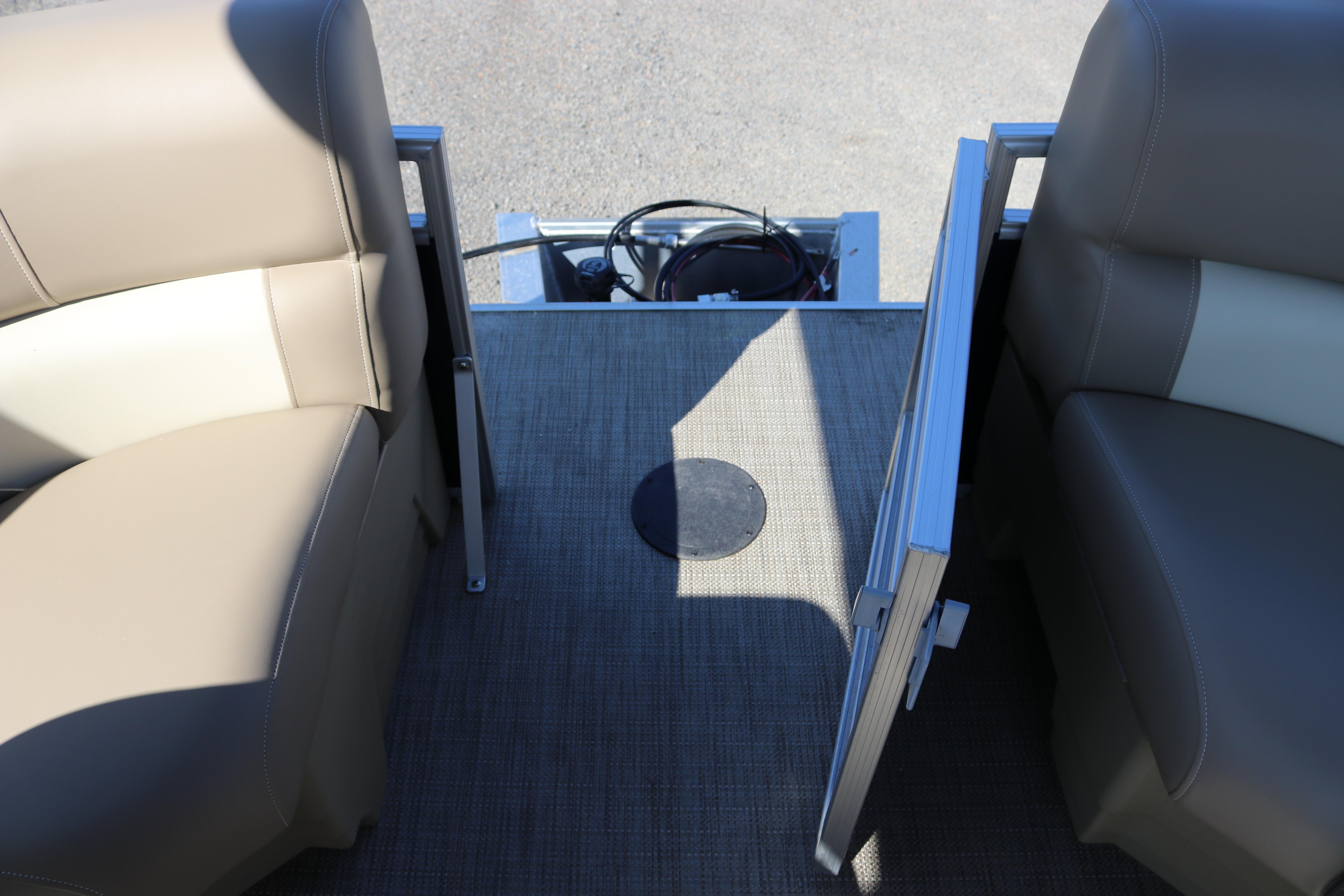 Interior view of 2025 Sun Chaser Vista Fish 18 pontoon boat with beige seating.