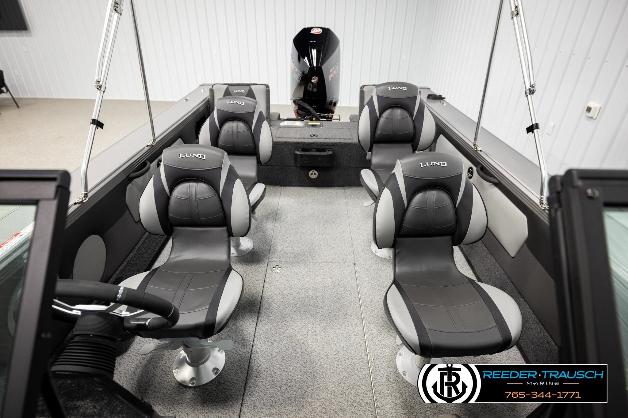 Interior of 2026 Lund 1975 Tyee boat with four gray seats.