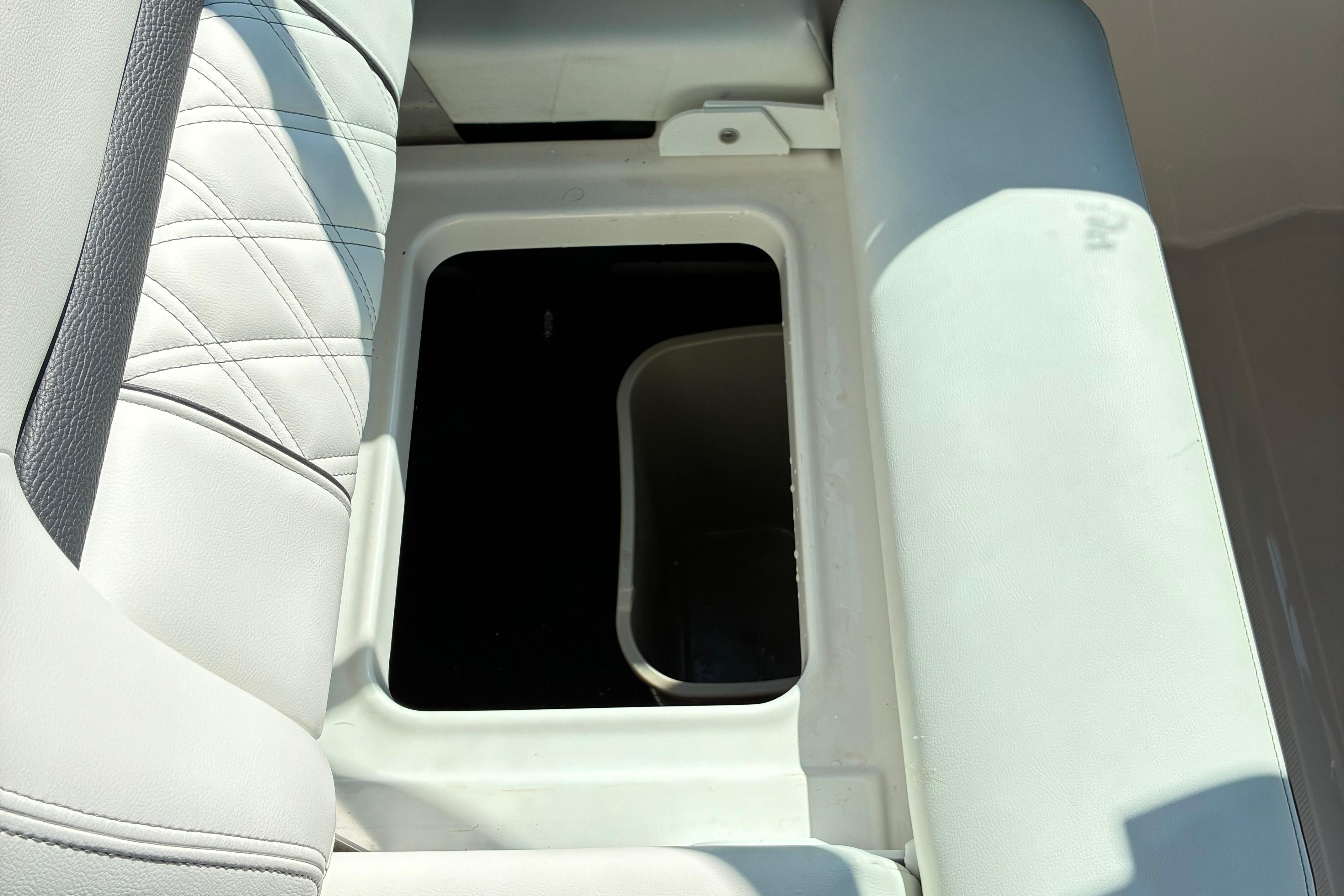 2025 Regal LS2 boat seat storage compartment, open with visible interior space.