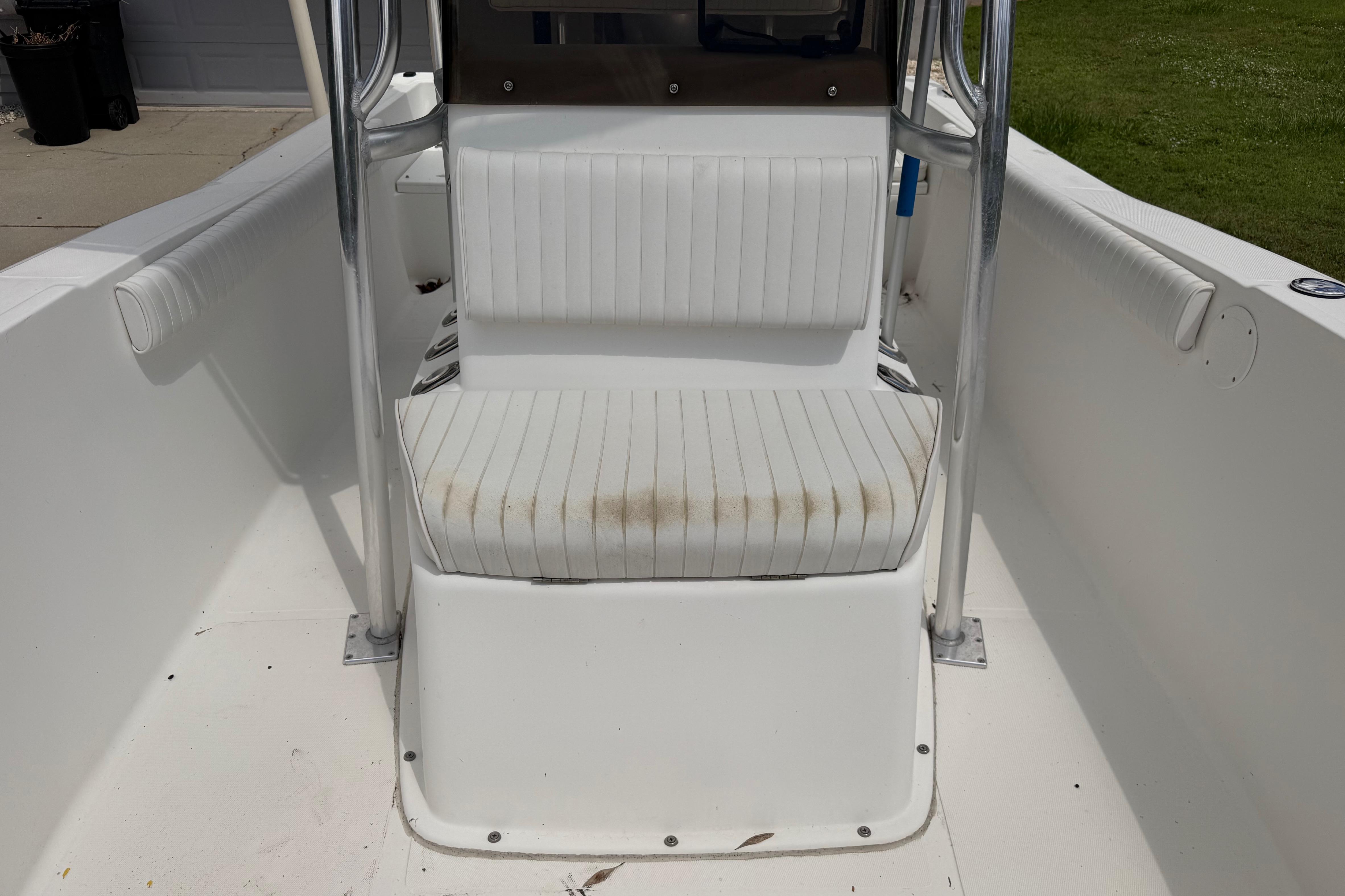 2012 Clearwater 2000 Center Console boat with white seating and stainless steel frame.