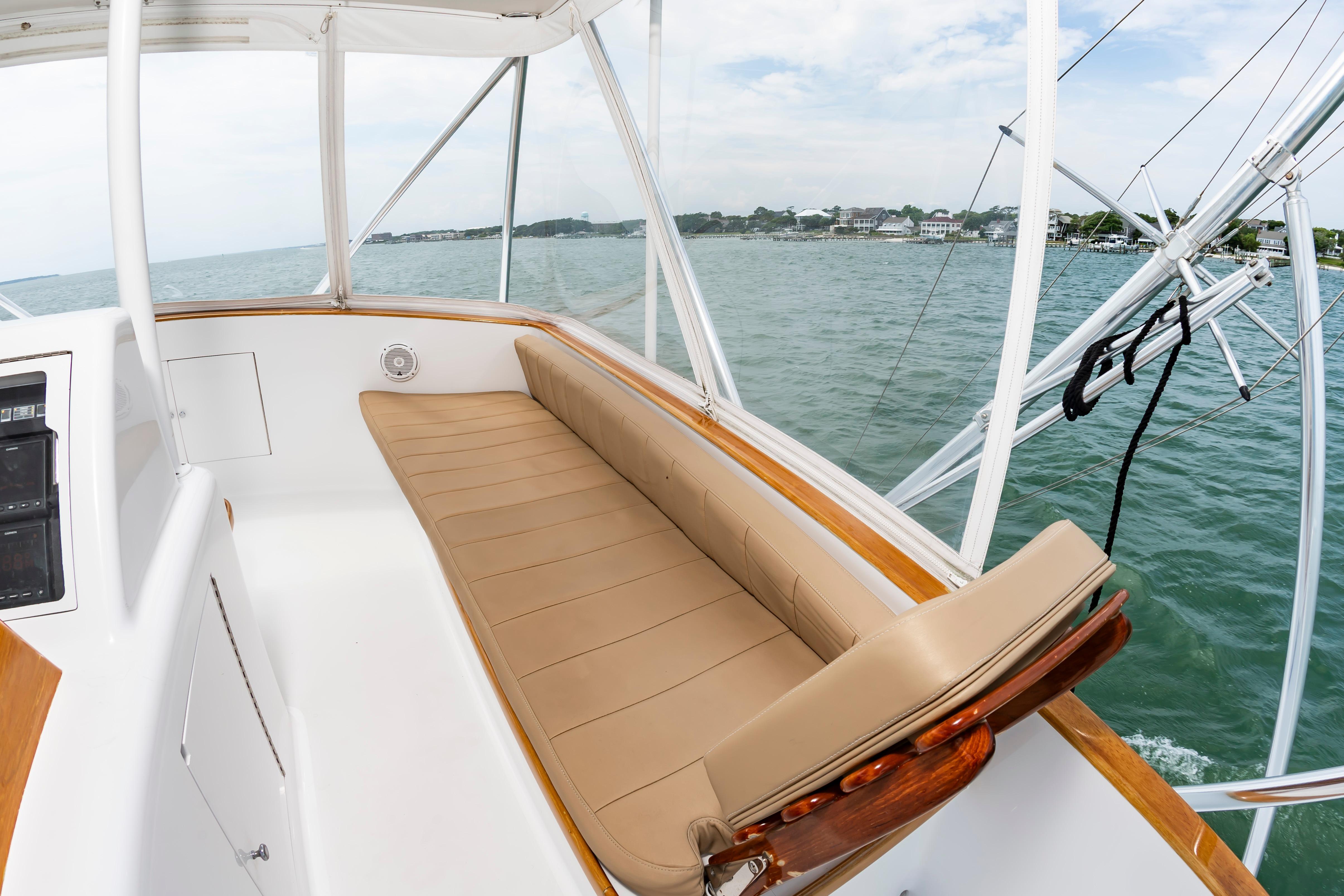 Luxurious seating on 1993 Custom Carolina Scarborough 56 Convertible yacht, overlooking serene waters.