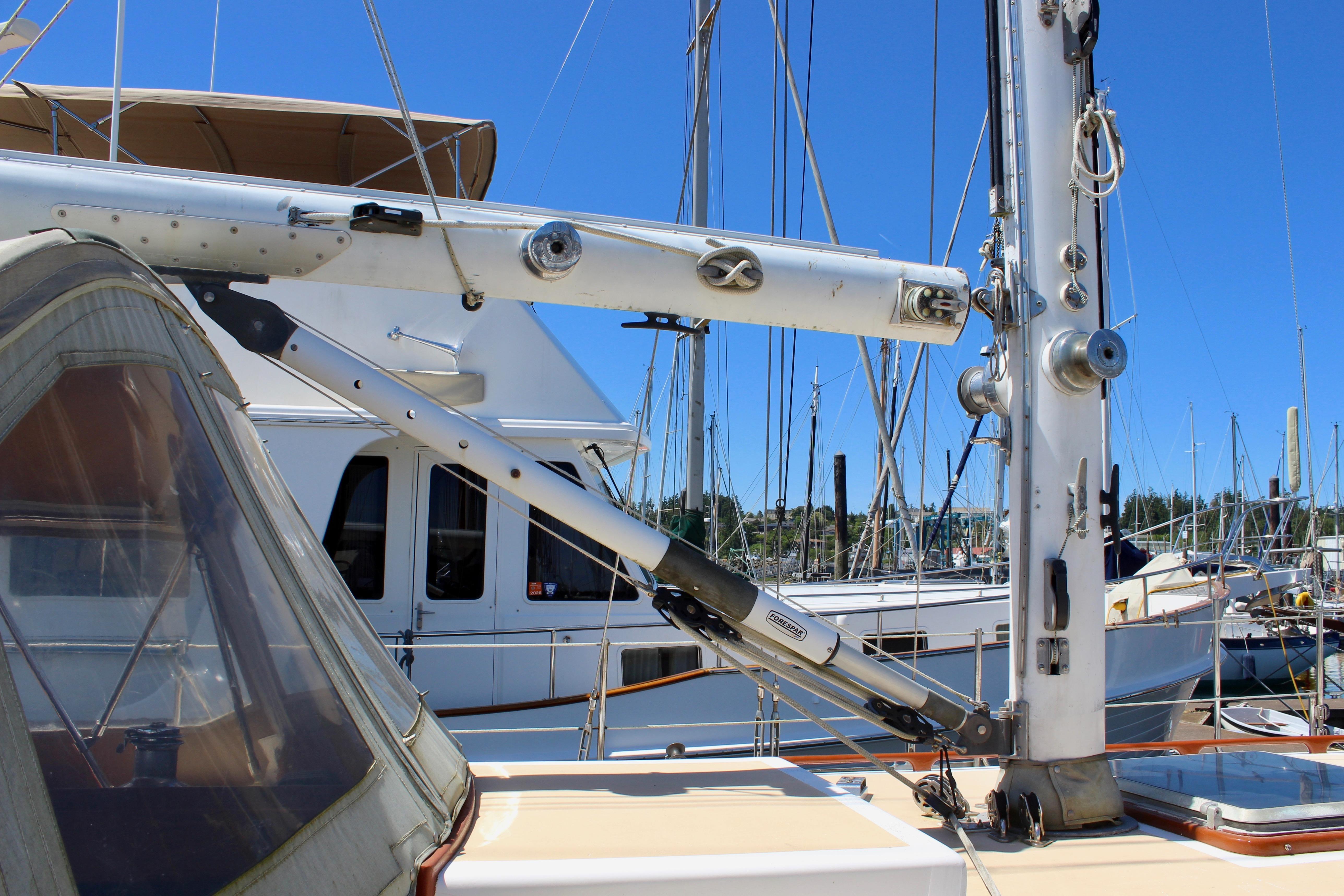 1981 Kelly Peterson 46 sailboat mast and rigging in a marina setting.