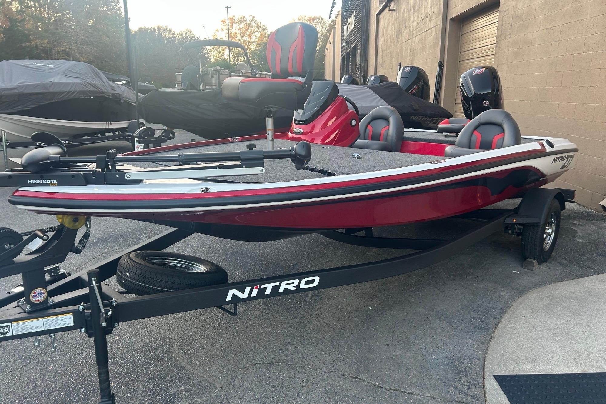 2026 Nitro Z17 boat in red on a trailer, featuring Minn Kota trolling motor.
