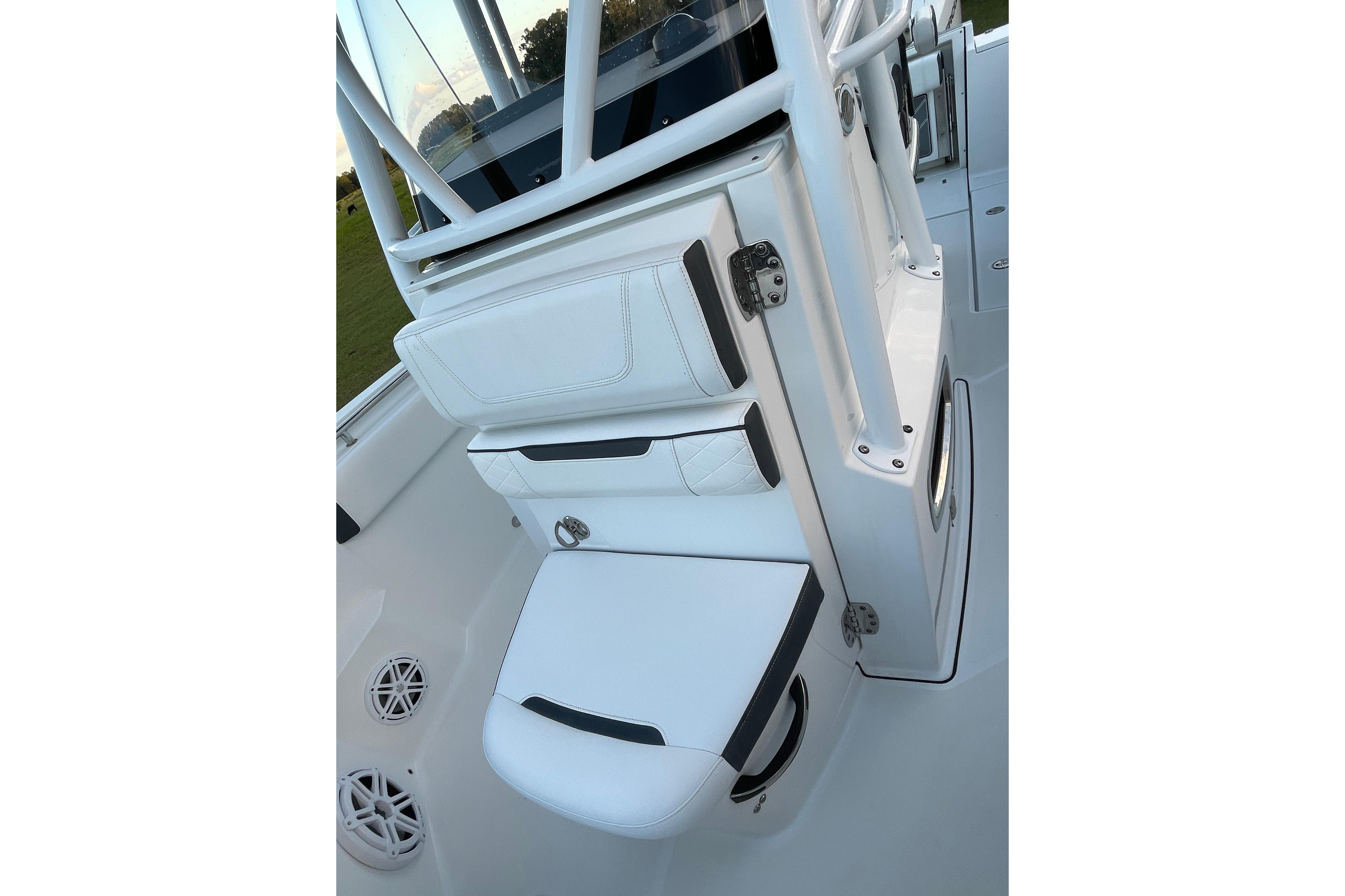 2022 Blackfin 252 CC boat interior with white seating and storage compartments.