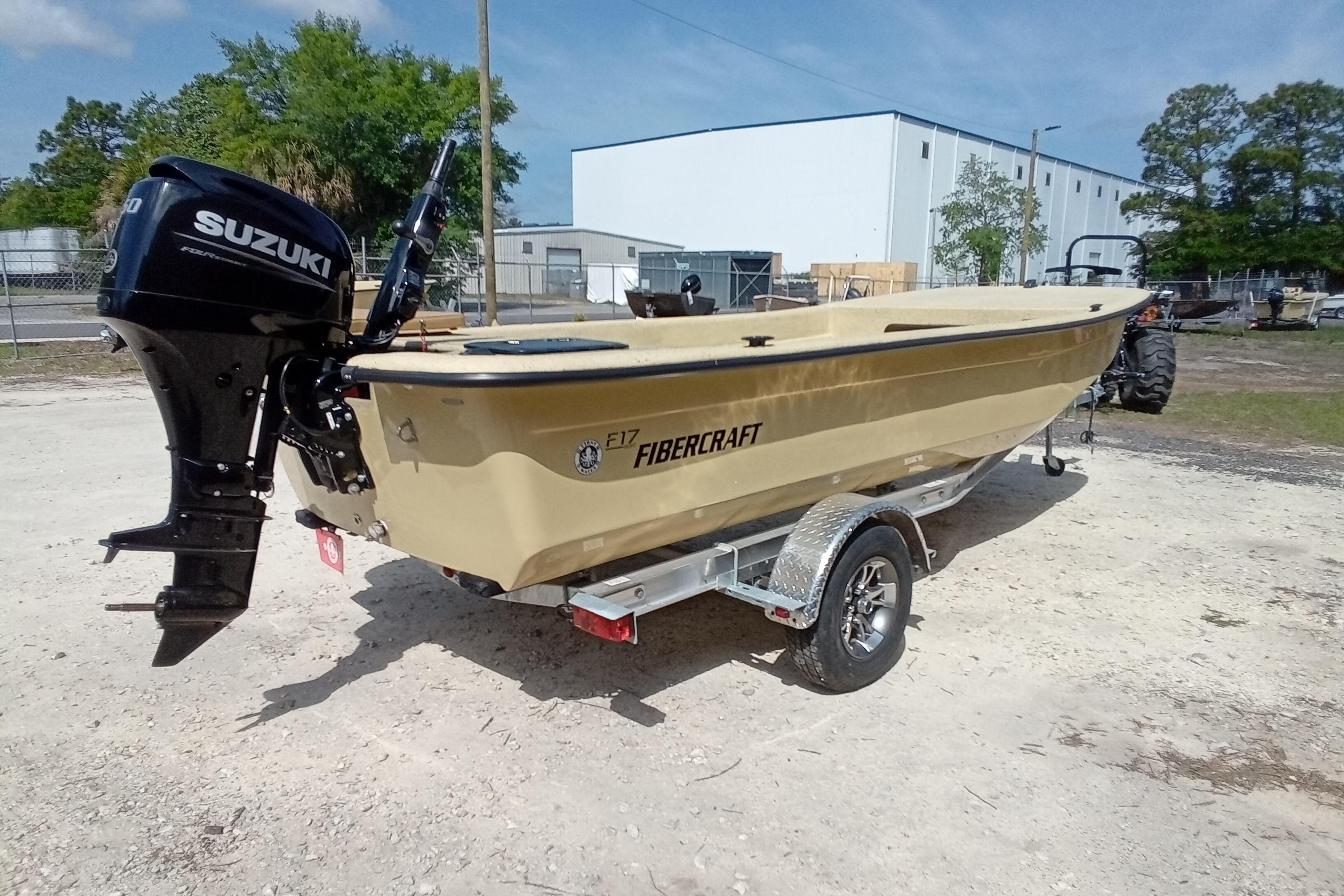 2025 Fibercraft F17 boat with Suzuki outboard motor on a trailer.
