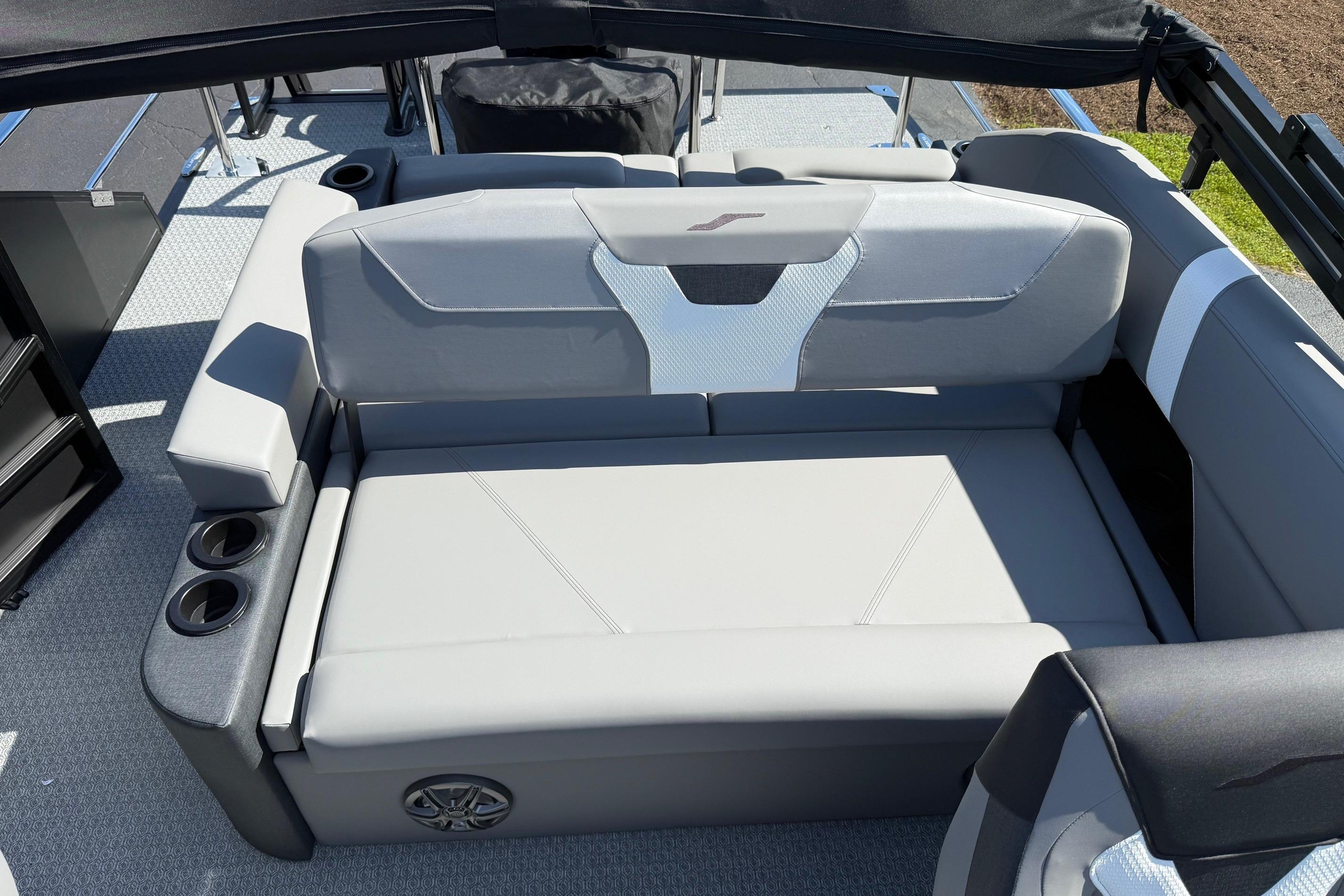 Luxurious seating on 2026 Evotti 521CS boat with cup holders and modern design.