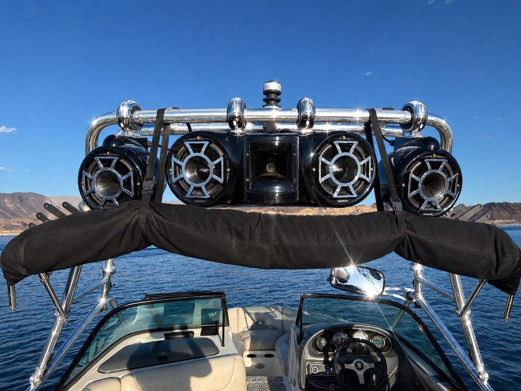 2003 Centurion Avalanche boat with speakers on the water.