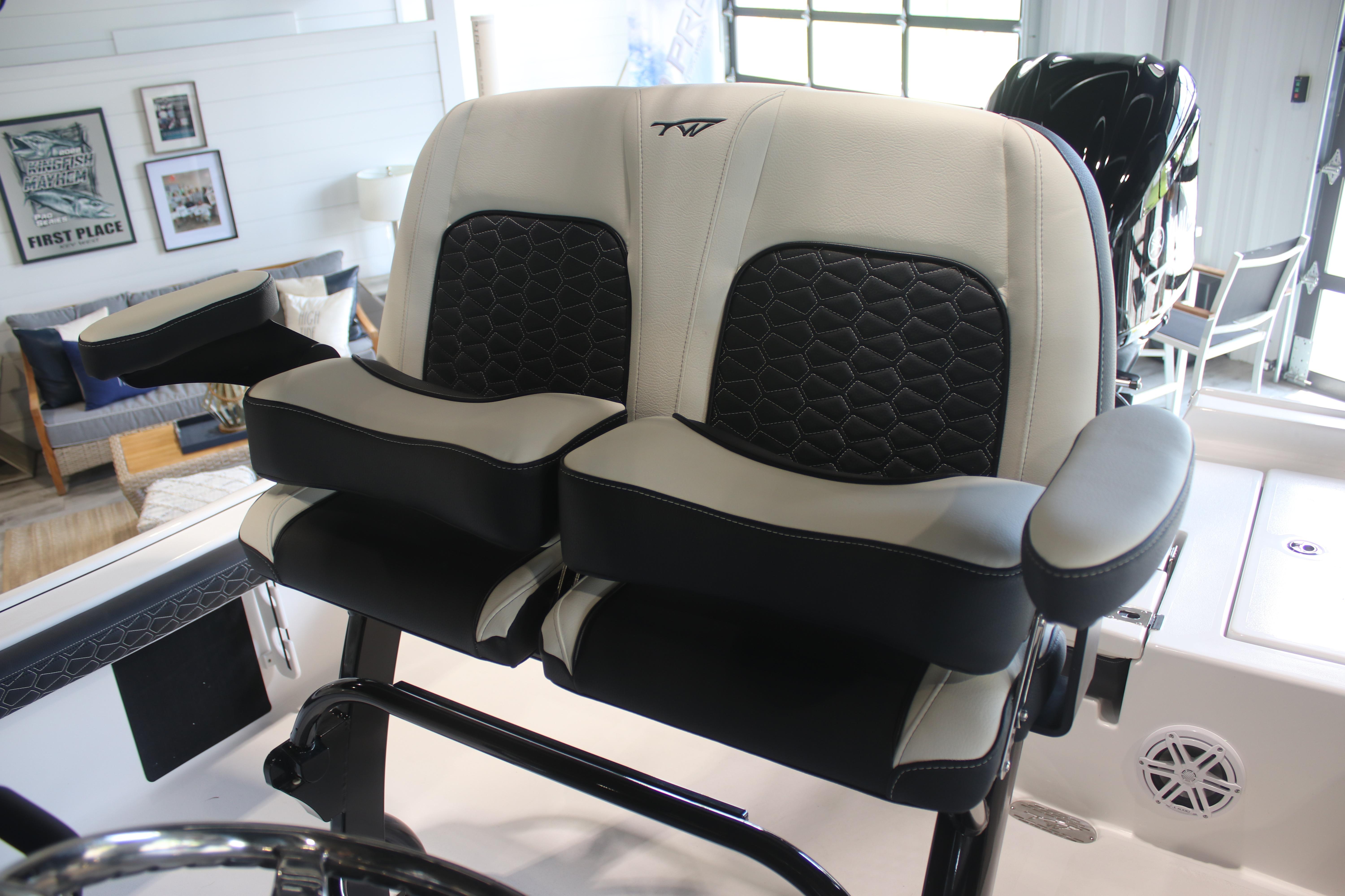 2026 Tidewater 2300 Carolina Bay boat seats with black and white upholstery in a modern interior.