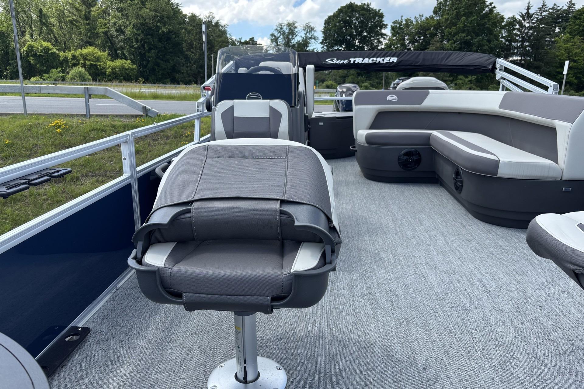 2026 Sun Tracker Bass Buggy 18 DLX pontoon boat interior with seating and helm.