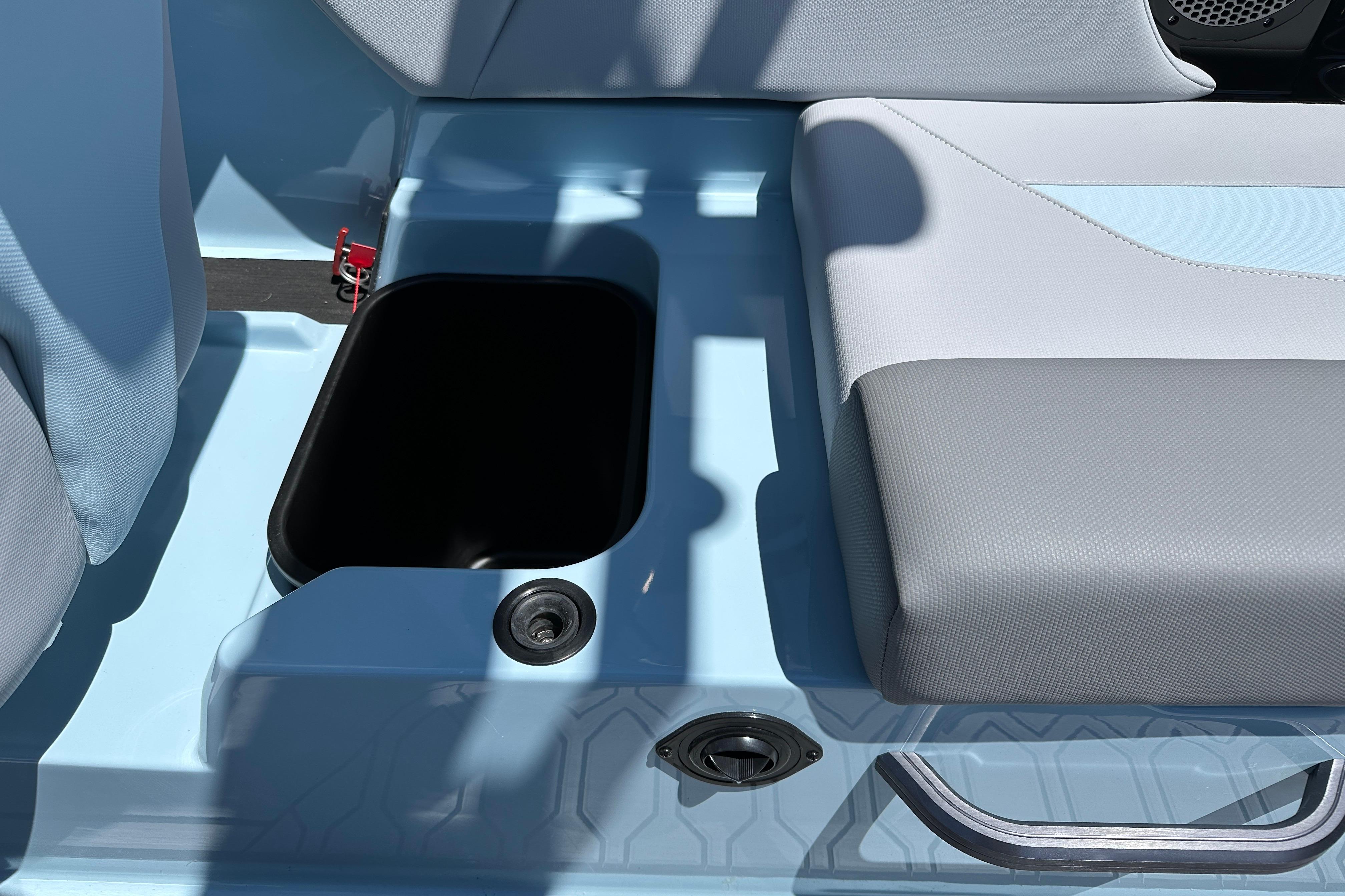 2023 MasterCraft NXT23 boat interior with storage compartment and seating.