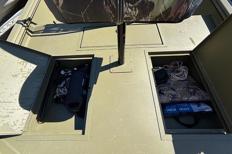 2022 Lowe Roughneck 1660 boat storage compartments with gear and accessories.